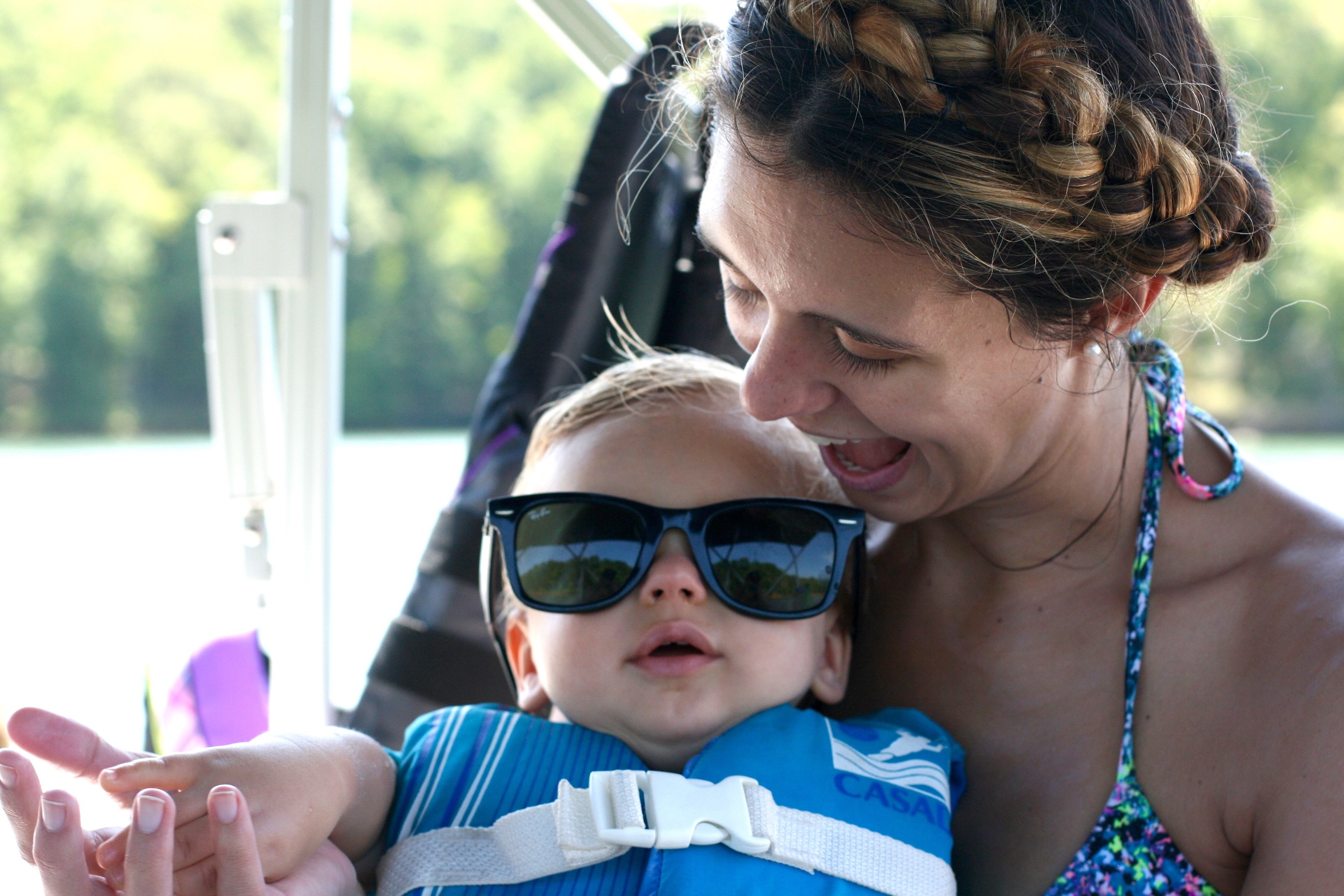He has his own sunglasses, but he still won't leave them on. We're working on it!