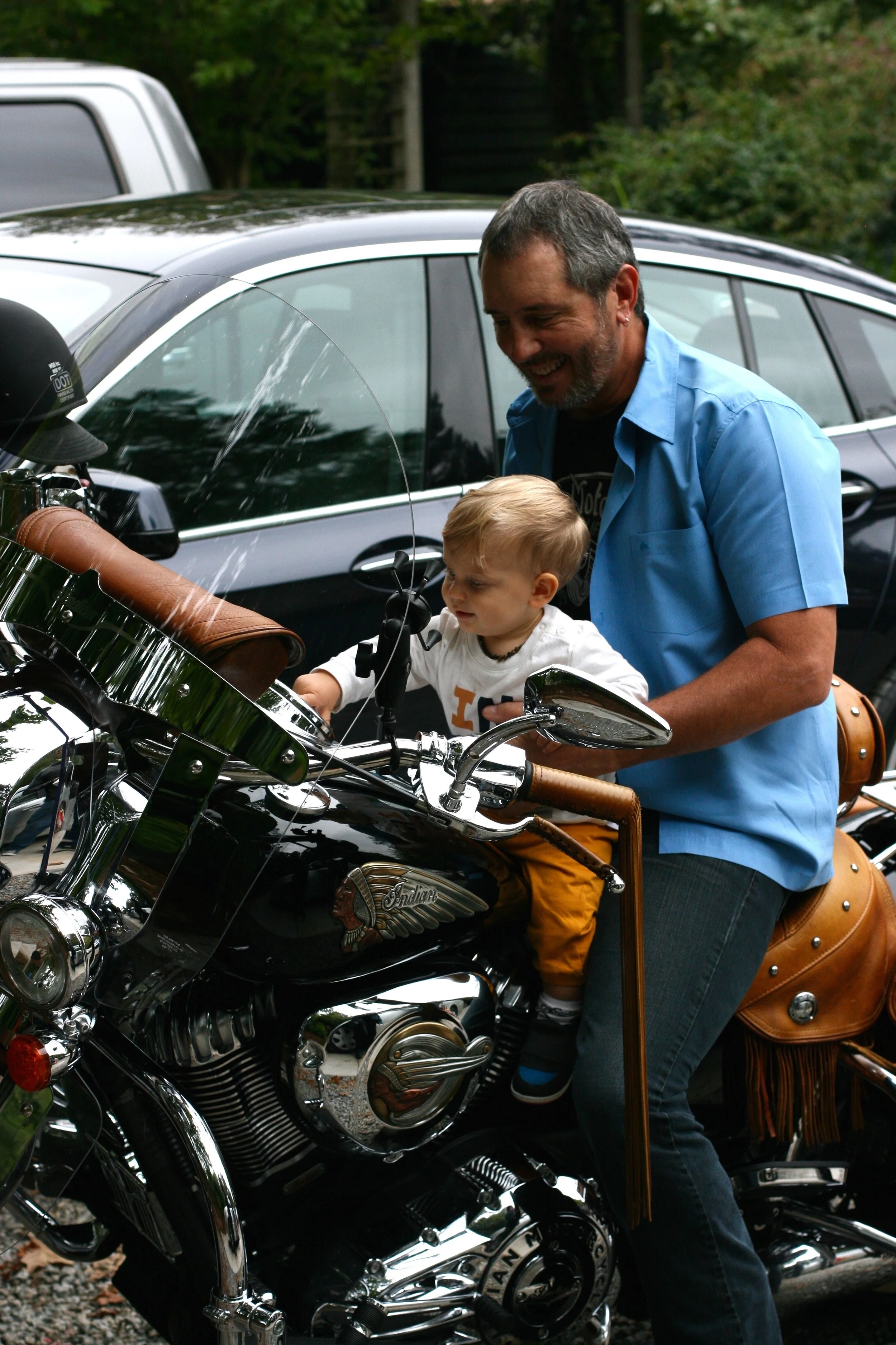 Everett LOVES my dad's Indian motorcycle. He makes the noises. And he always wants to sit on it. But when my dad fires the thing up, he cries.