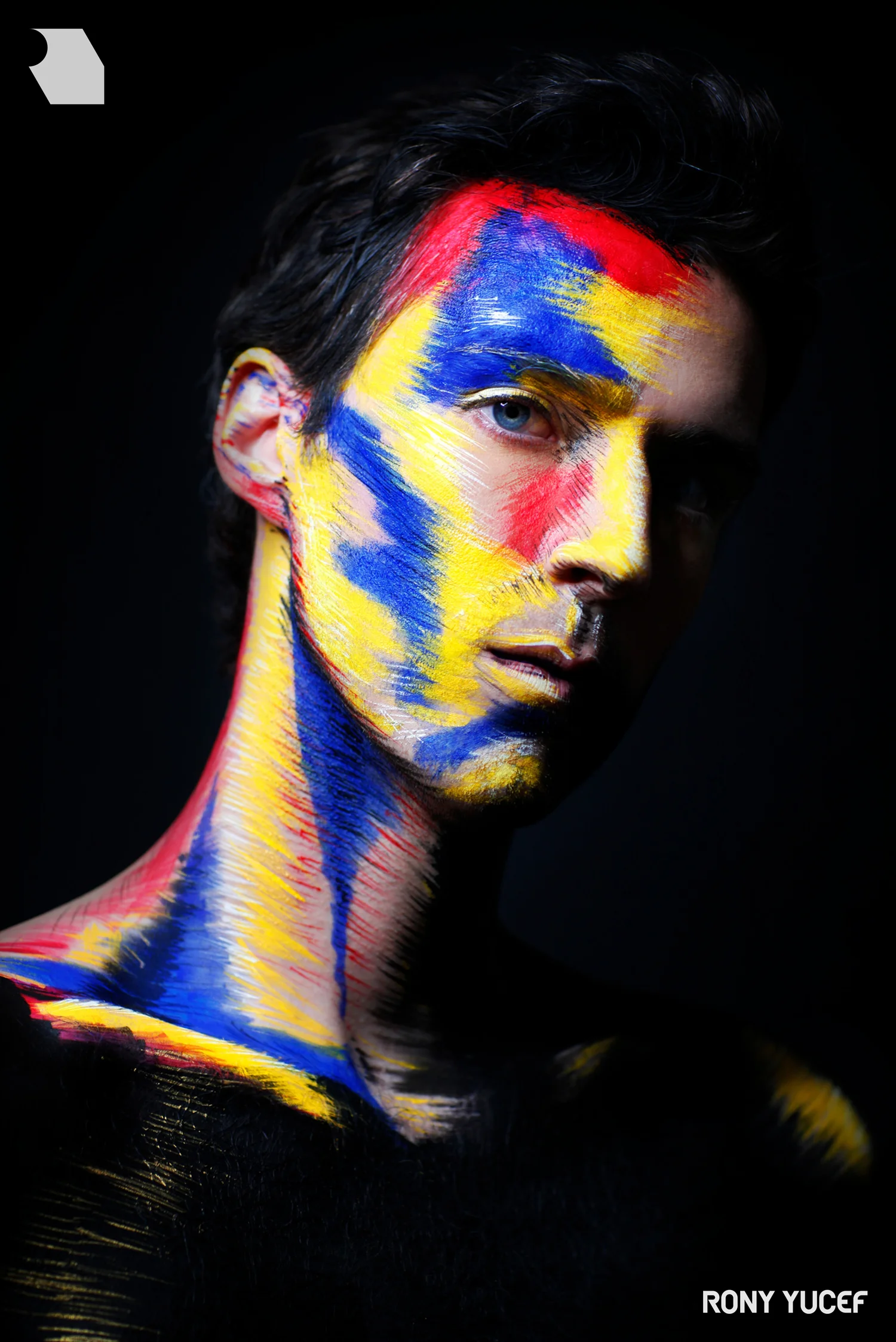 red, blue and yellow artistic makeup outcome by Rony Yucef