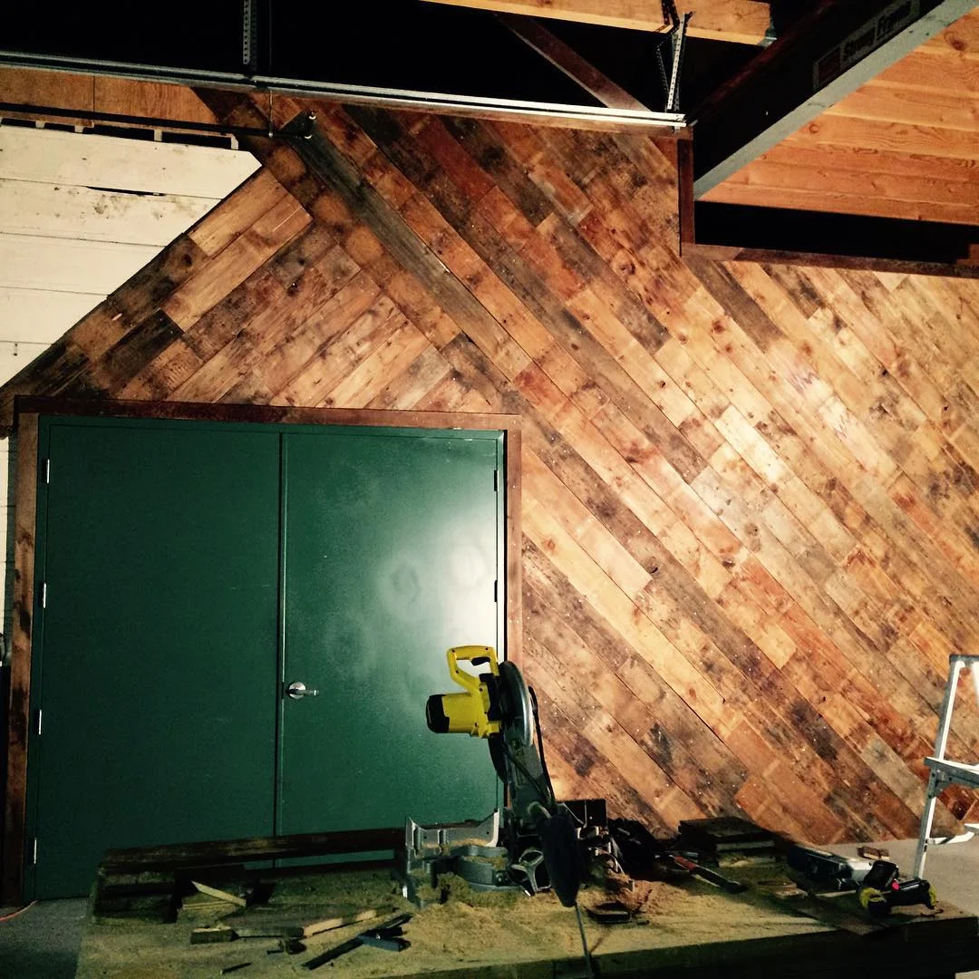 Our salvaged wood wall almost complete!