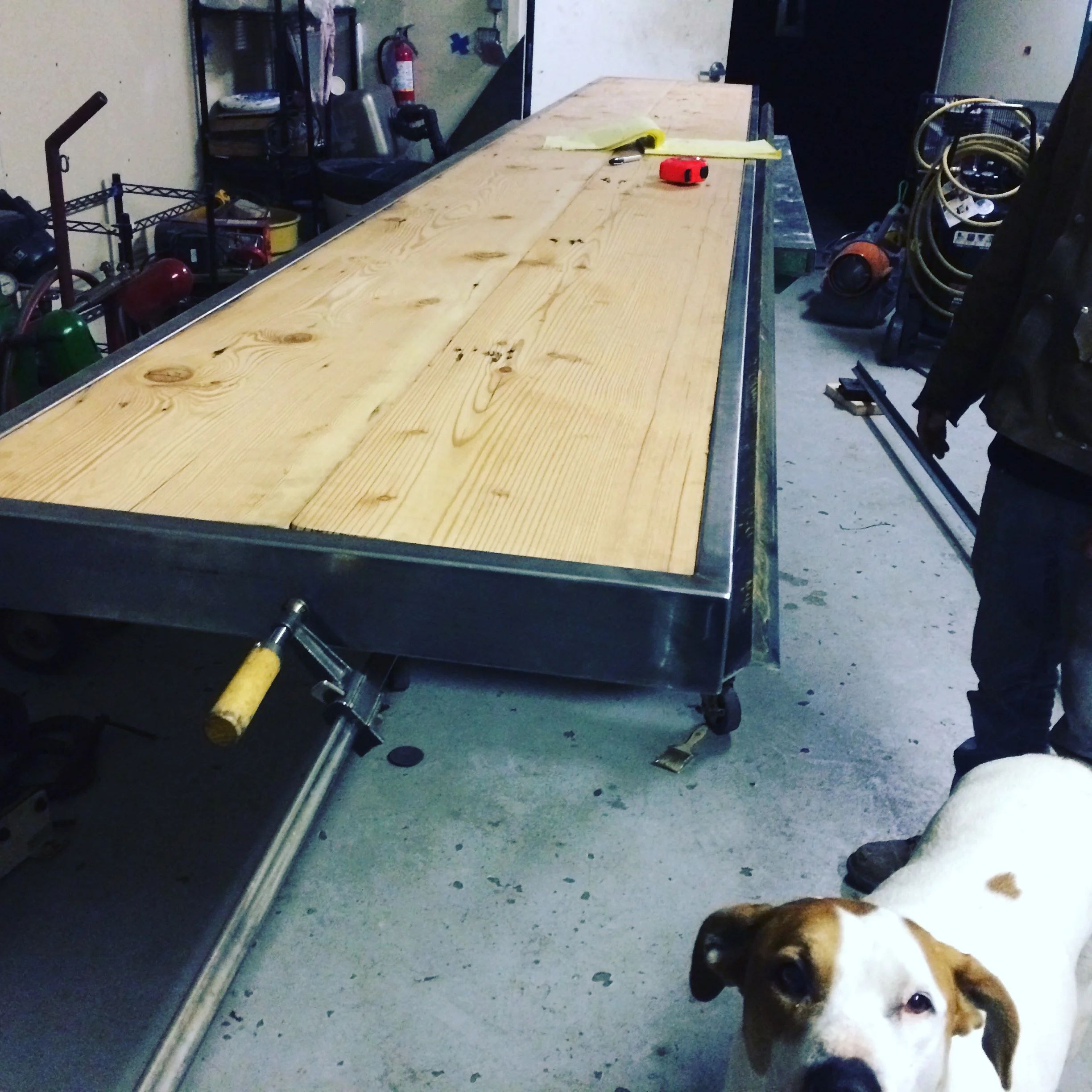 Steel and reclaimed wood coworking counter getting the finishing touches (and Jib the shop dog)!