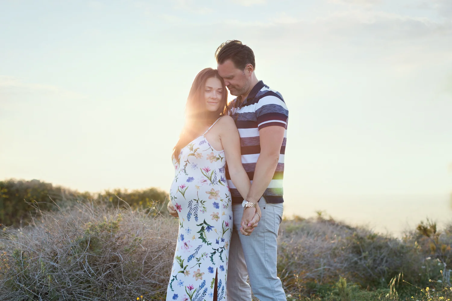 malta maternity photographer golden bay sunset session parents to be happy couple in love dress casual photo shoot golden bay happy expecting dress malta