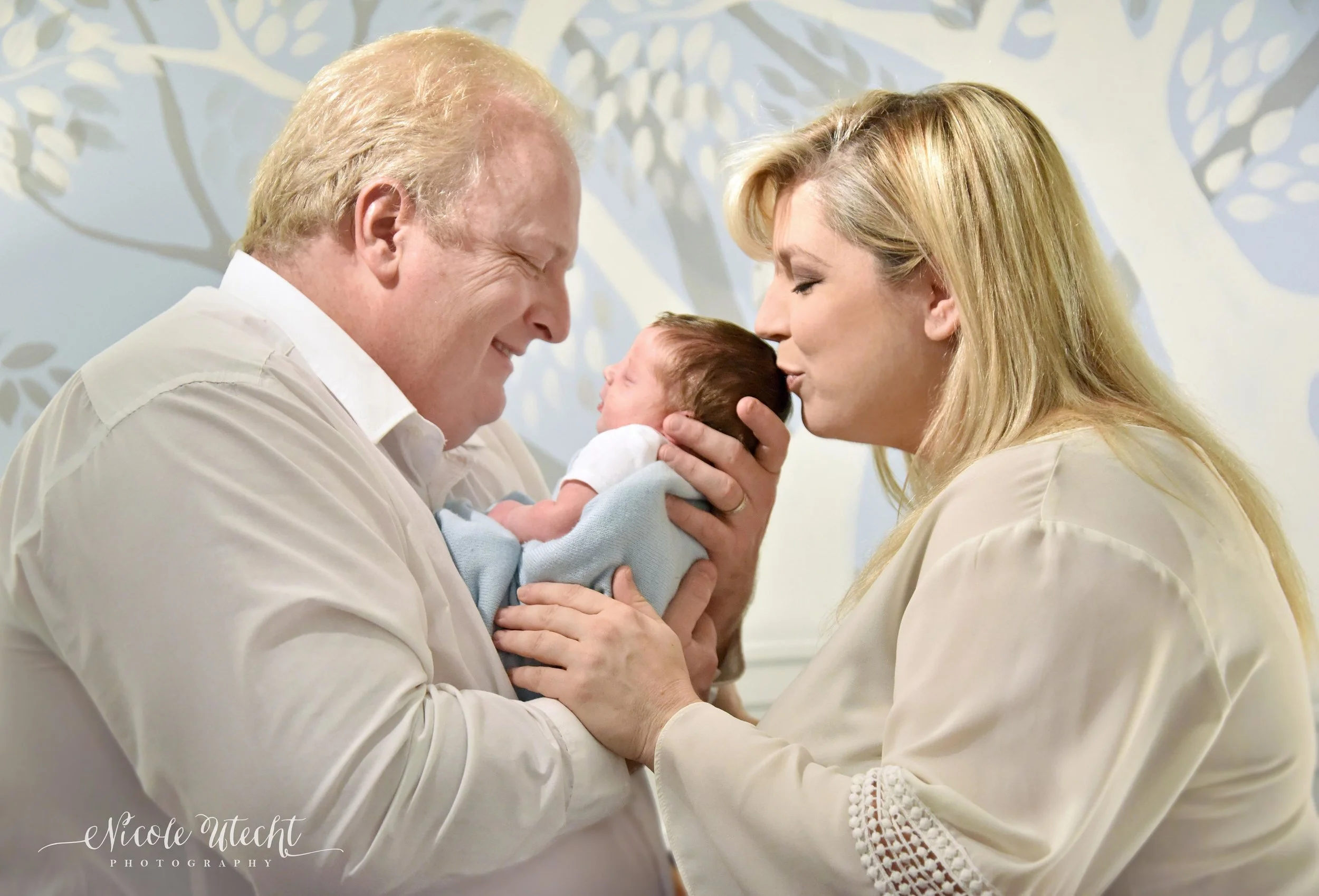 Eddie and Christy enjoying their baby boy. Photo by Nicole: www.nicoleutecht.com