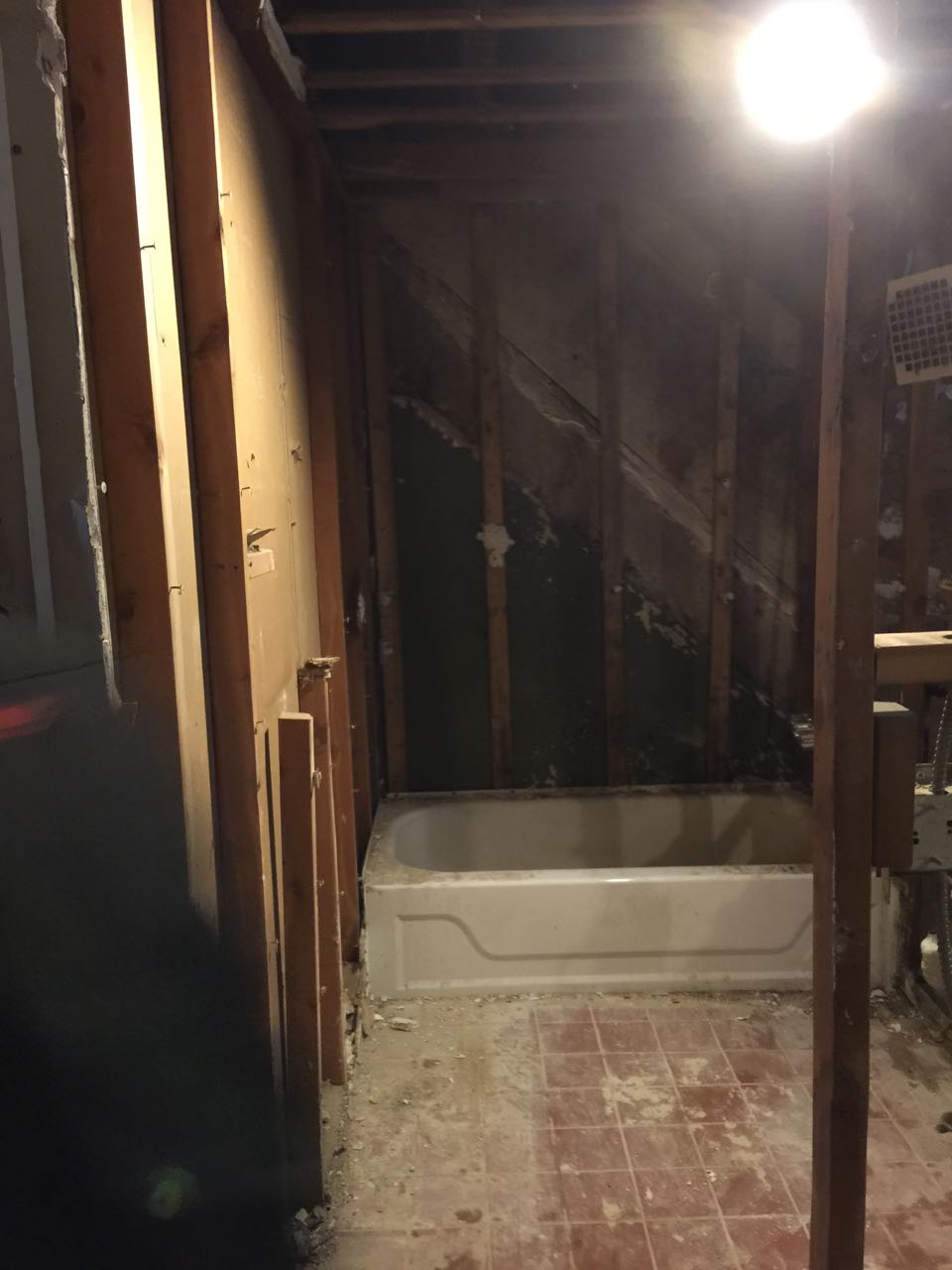 The bathtub was hanging on by a hair, the tenant was lucky he hadn't filled it up and gotten in or it would have fallen through. 