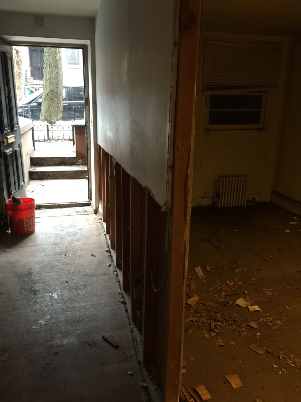 We would later flip the entry way - returning the entry to under the stoop and making this doorway a window again.