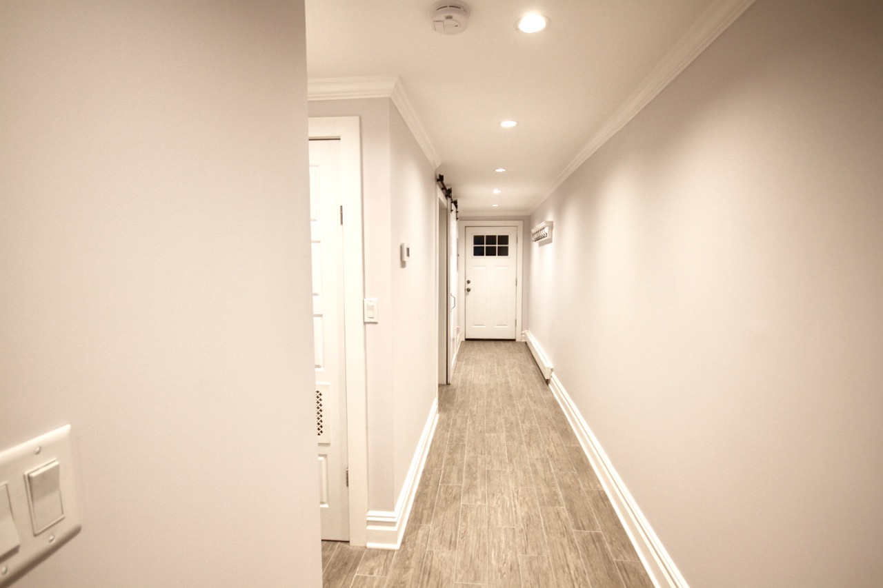 I stole some real estate from the bedroom, but having a wide, bright hallway was important.