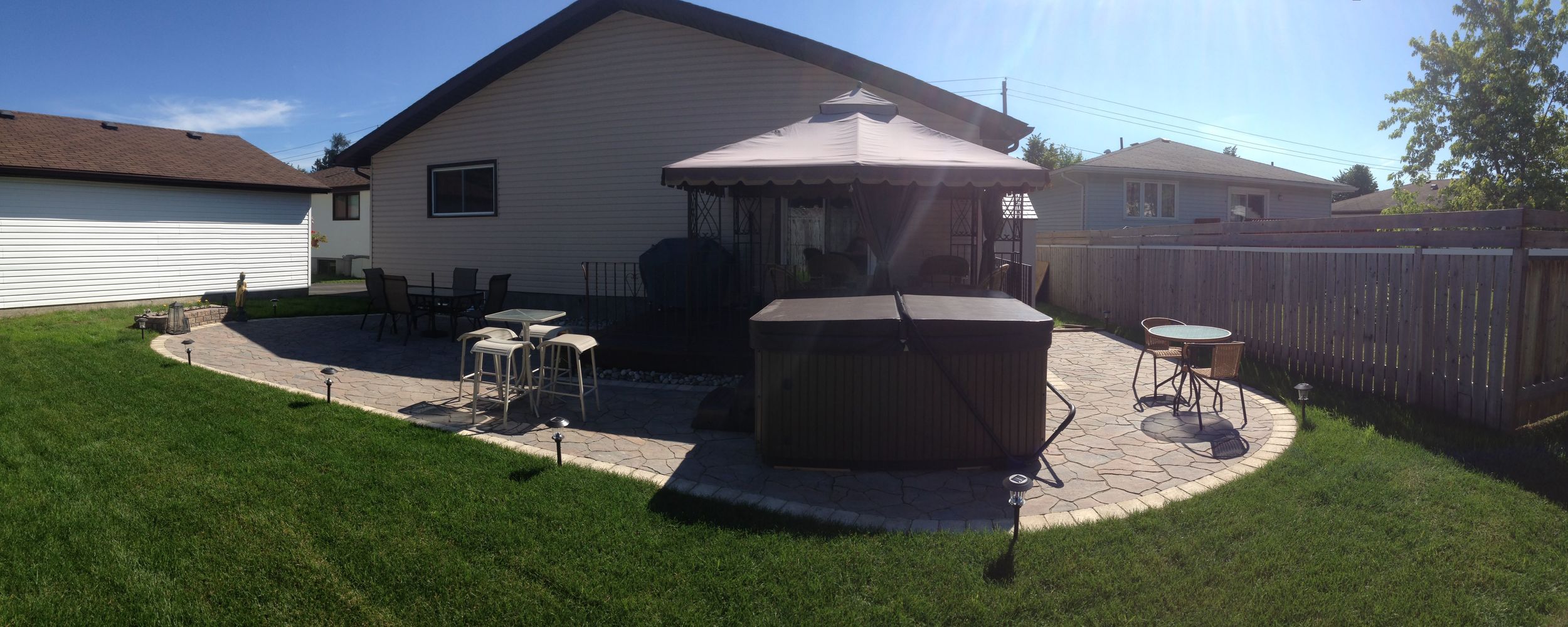  Ask us for the before picture of this yard. New Grading, a new stone patio, a custom flower planter, and new sod transformed the look of this backyard. 