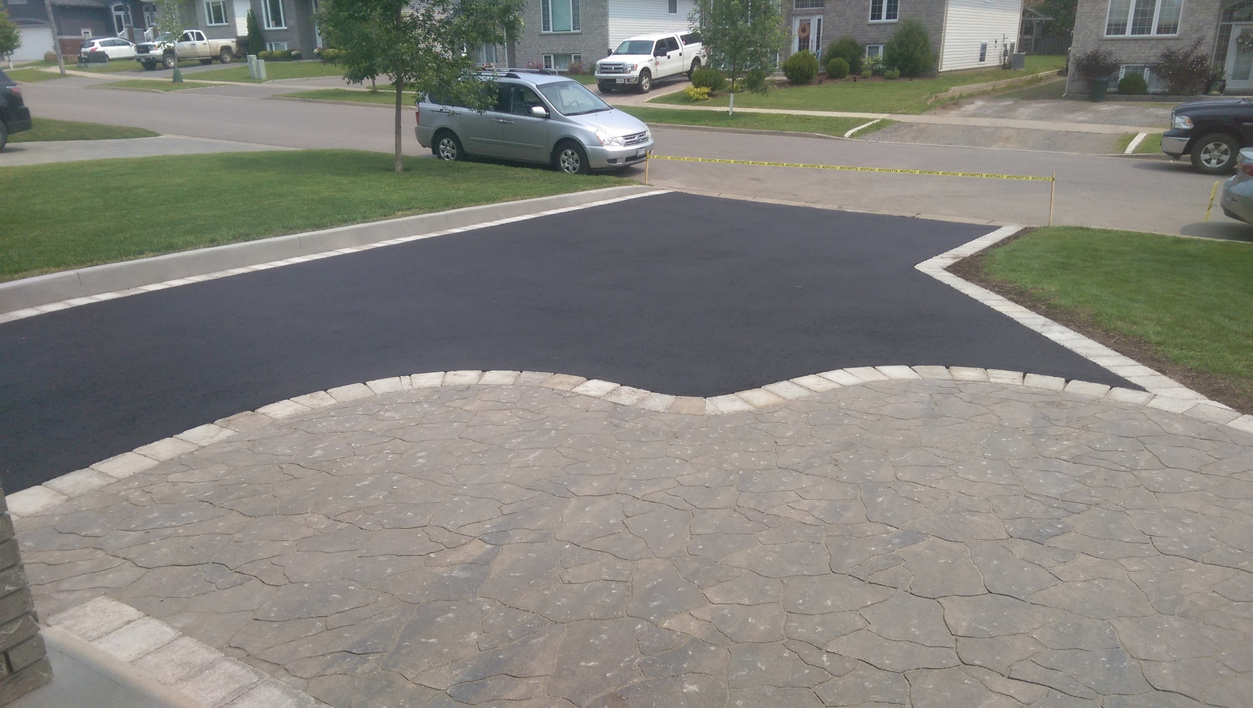 paving stone landing, border, concrete curb, asphalt grading