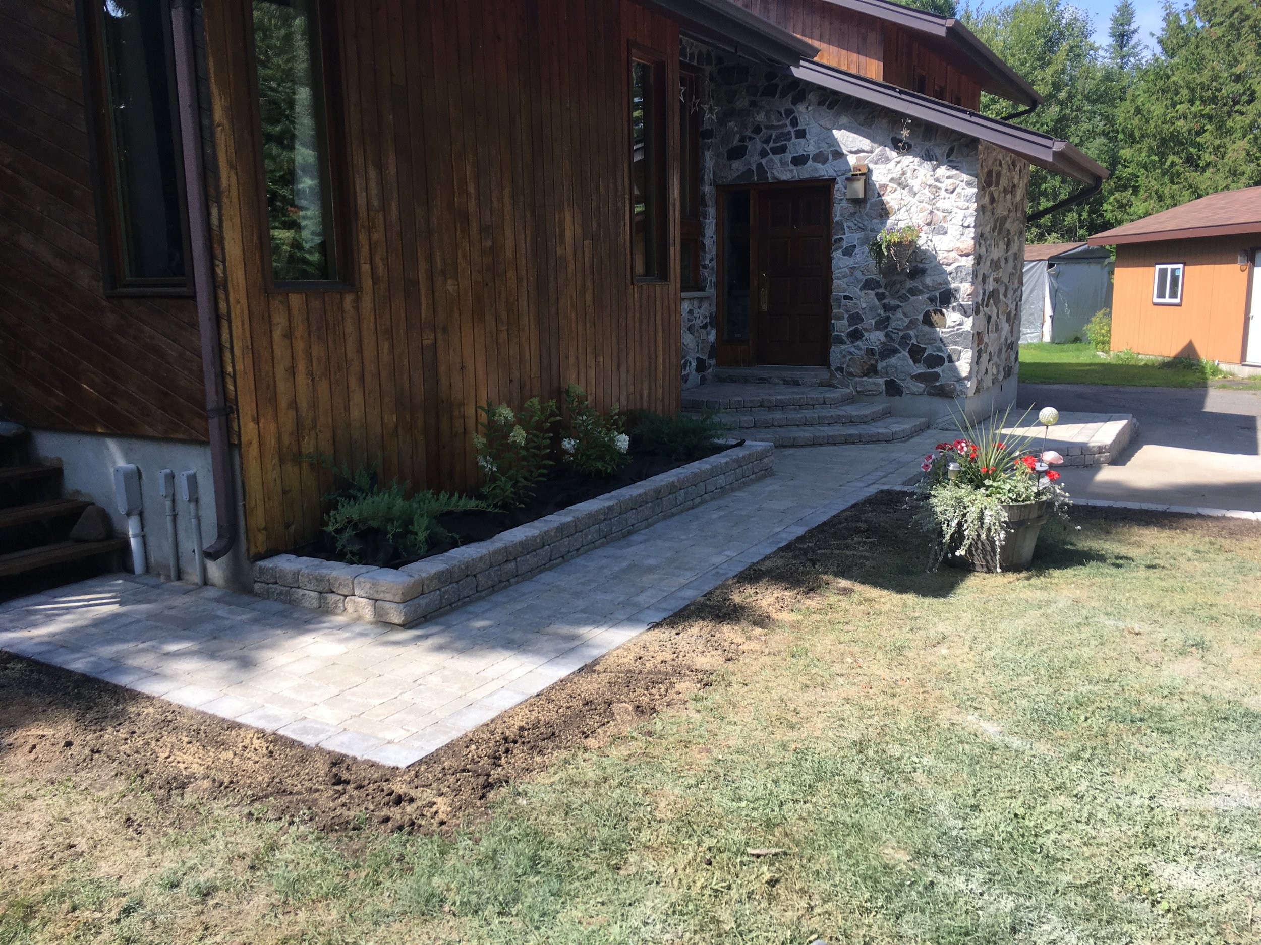 Roman Stackstone flower beds and Paving Stone pathway