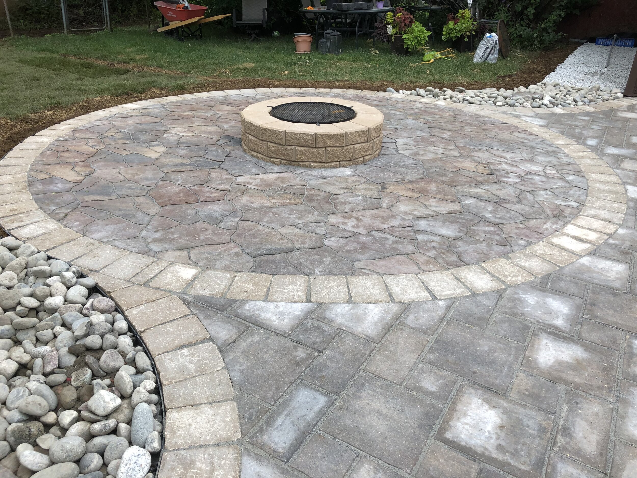 Flagstone circle patio with a fire pit