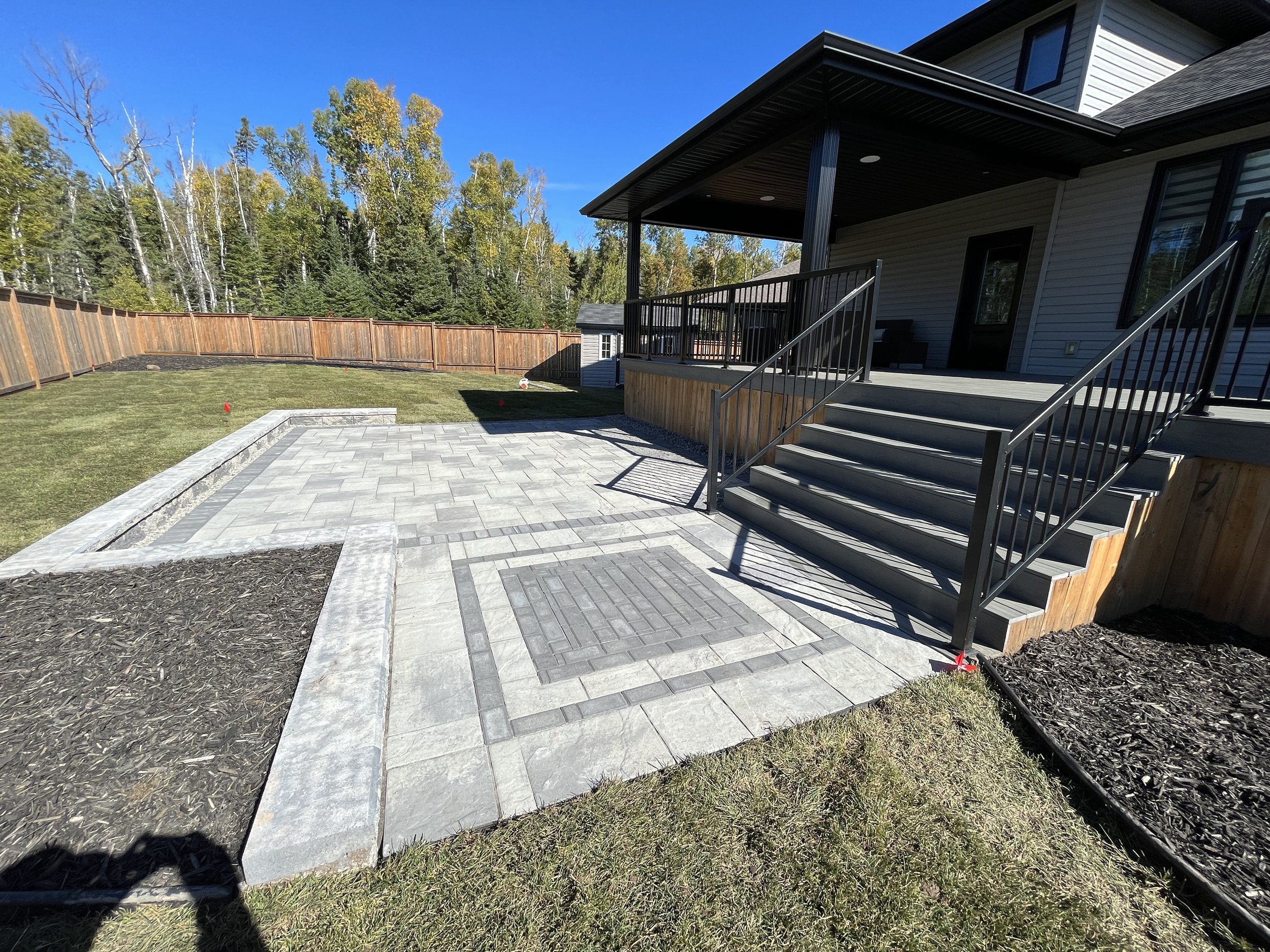 Browns Appian Paver Patio with a retaining wall and Inlay