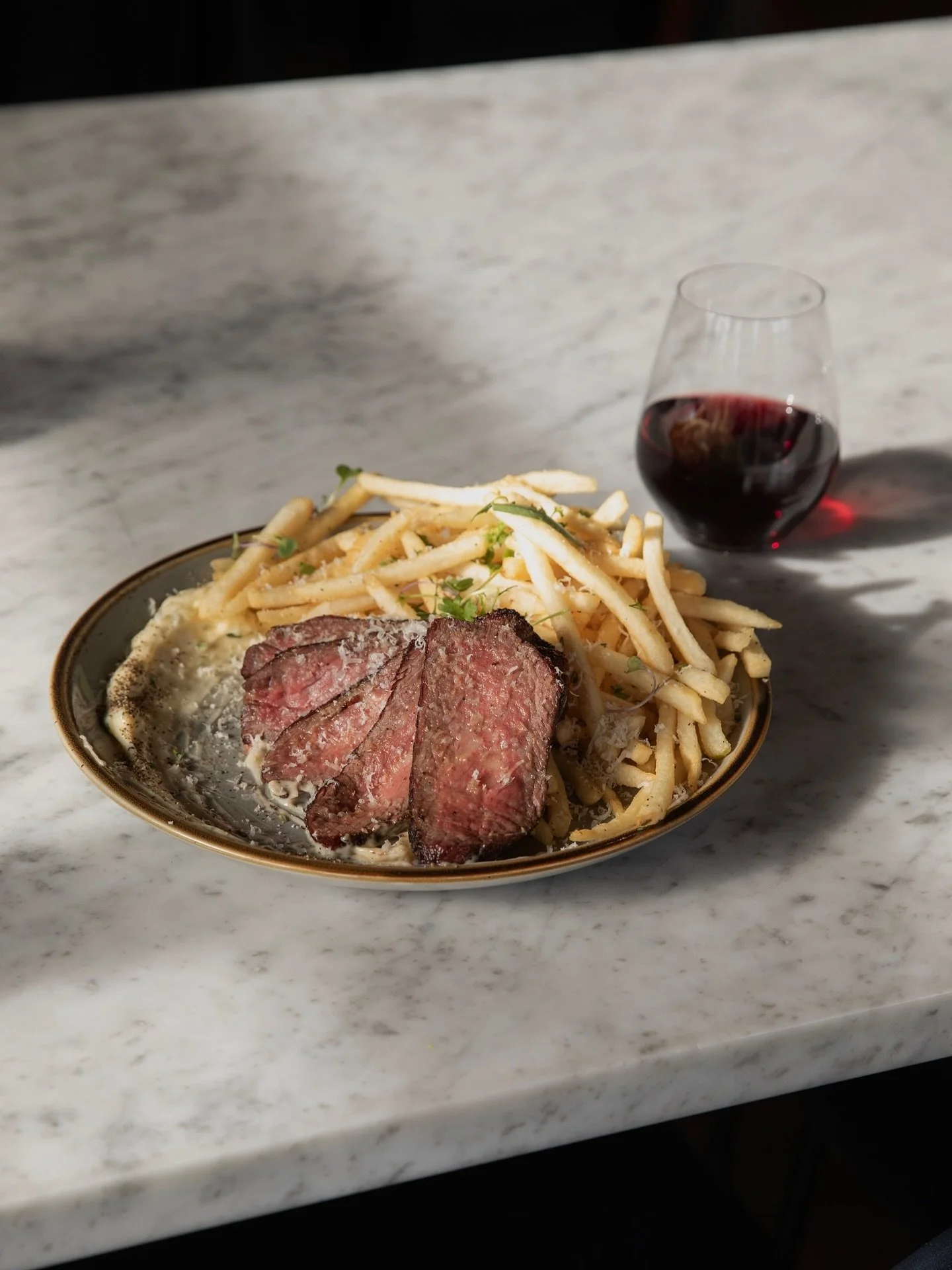 Shining a spotlight 1875 beef steak frites. Needless to say, it&rsquo;s (medium)well deserved!

House smoked bavette steak, served with shoestring fries, shaved pecorino, and homemade herbed aioli. Perfectly paired with RHM&rsquo;s house wine Tractor