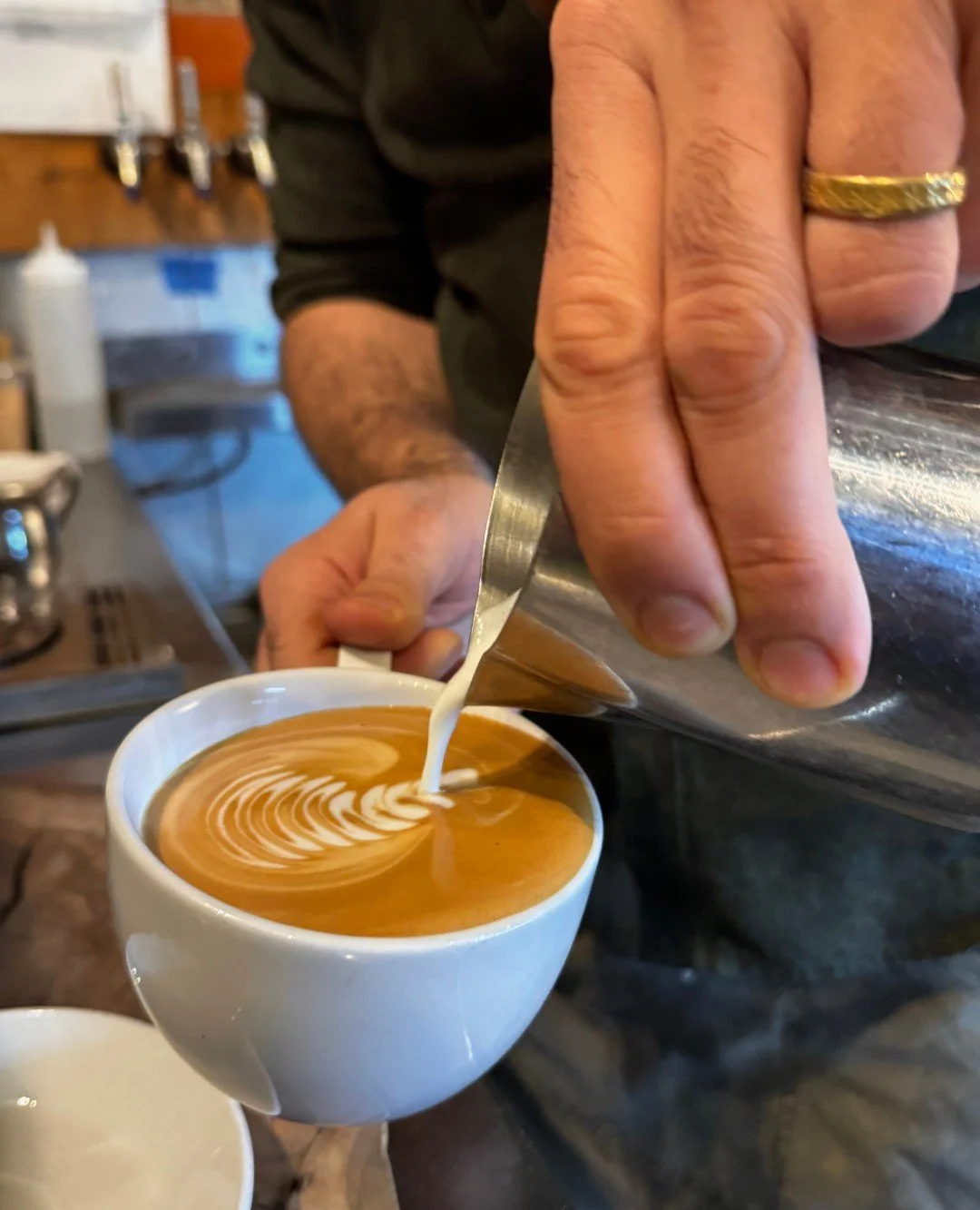 Our incredible team member and barista lead, Micheal, has created something truly unique for you to try!

Introducing the Olio Nuovo Olive Oil Latte. It's made with Durant's fresh pressed arbequina olive oil, lemon oleo saccharum, jacobsen honey, cha