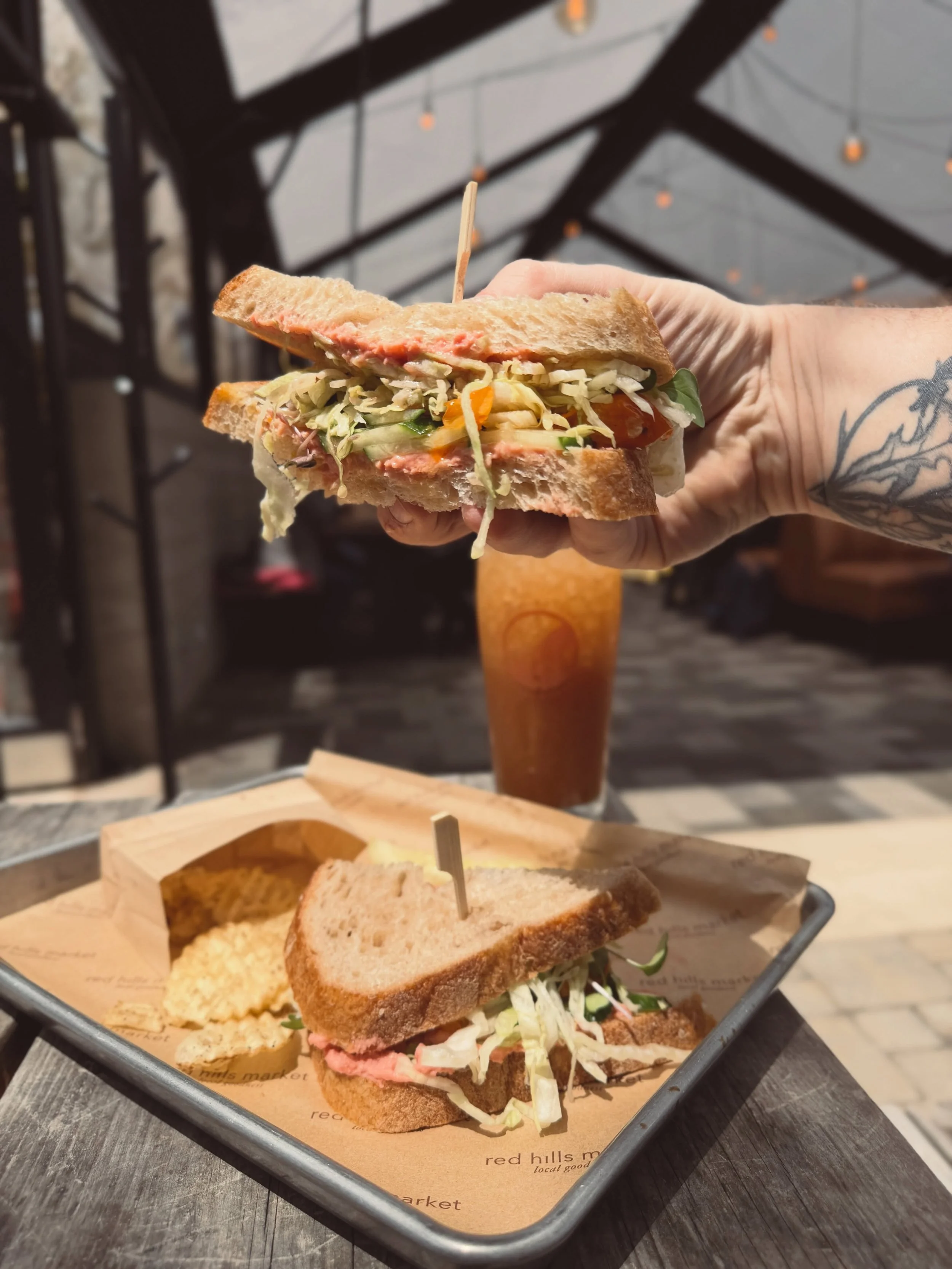Just as tasty as it is colorful!

VW bus sandwich: tomatoes, cucumbers, sprouts, crunchy greens, rustic sourdough, beet hummus, and red wine vinaigrette

Also... ask about our rotating house made shrubs
