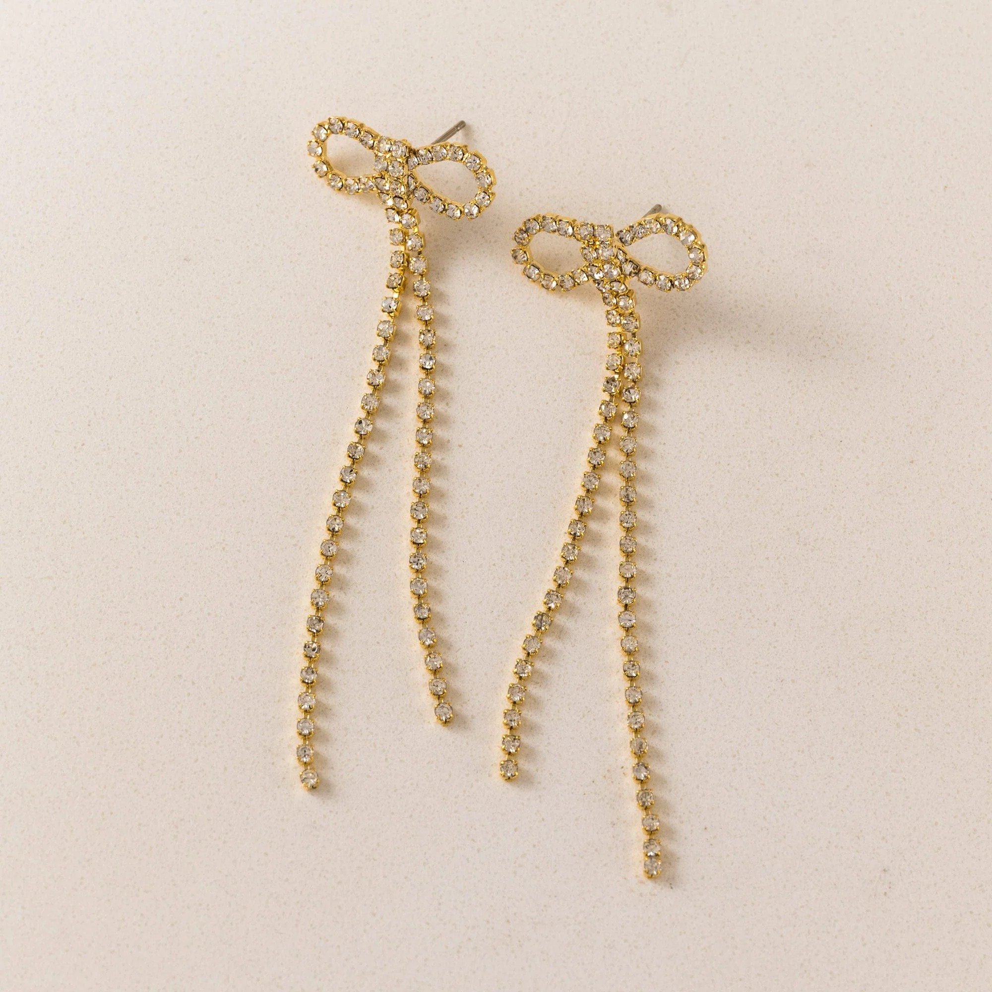 imgi_244_Luxe_Bow_Earrings_-_Gold_1x1_JZ80069-Edit.jpg