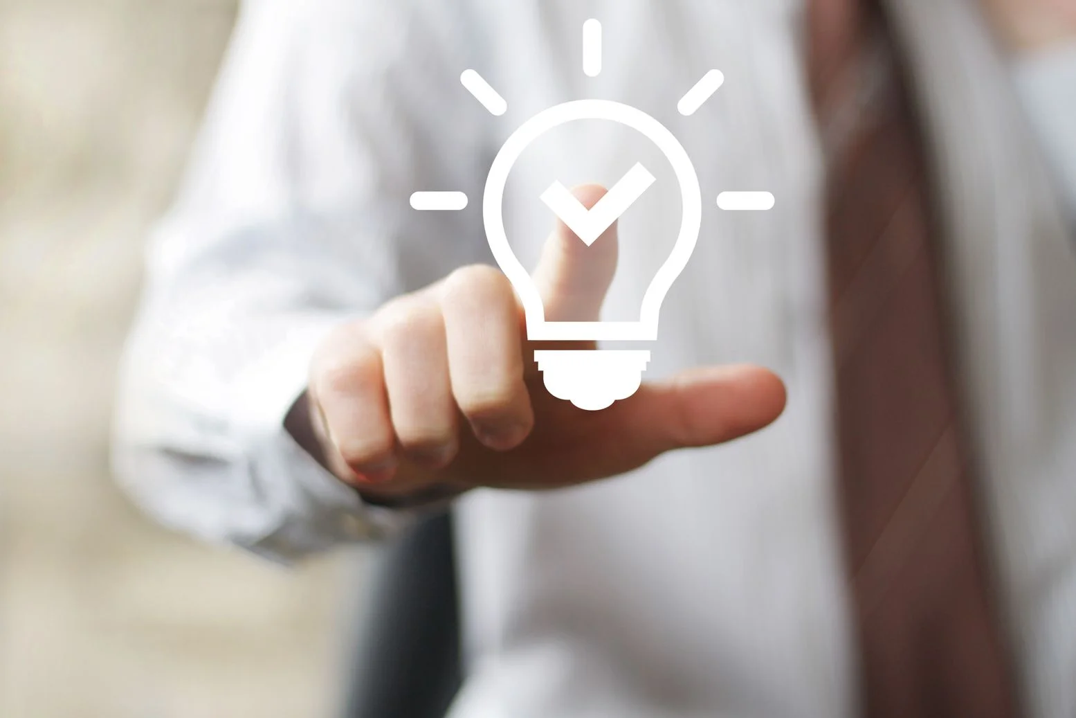 First page - Finger touching lightbulb for web.jpg