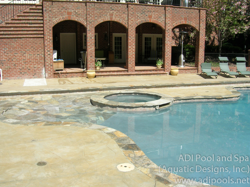 6-pool-with-beach-entry-and-spa.jpg