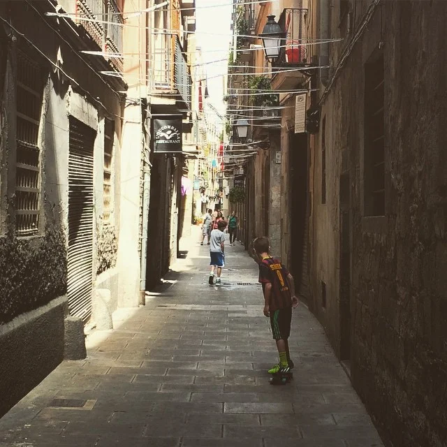 The boys in El Born, Ezra on his penny board