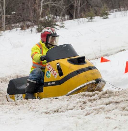 Gord at a snowmobile race, taking names against the young guys with his sweet Ski-doo