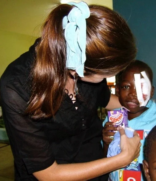Roxanne Robbins with Okello Dikens at Mulago Hospital in Kampala, Uganda.