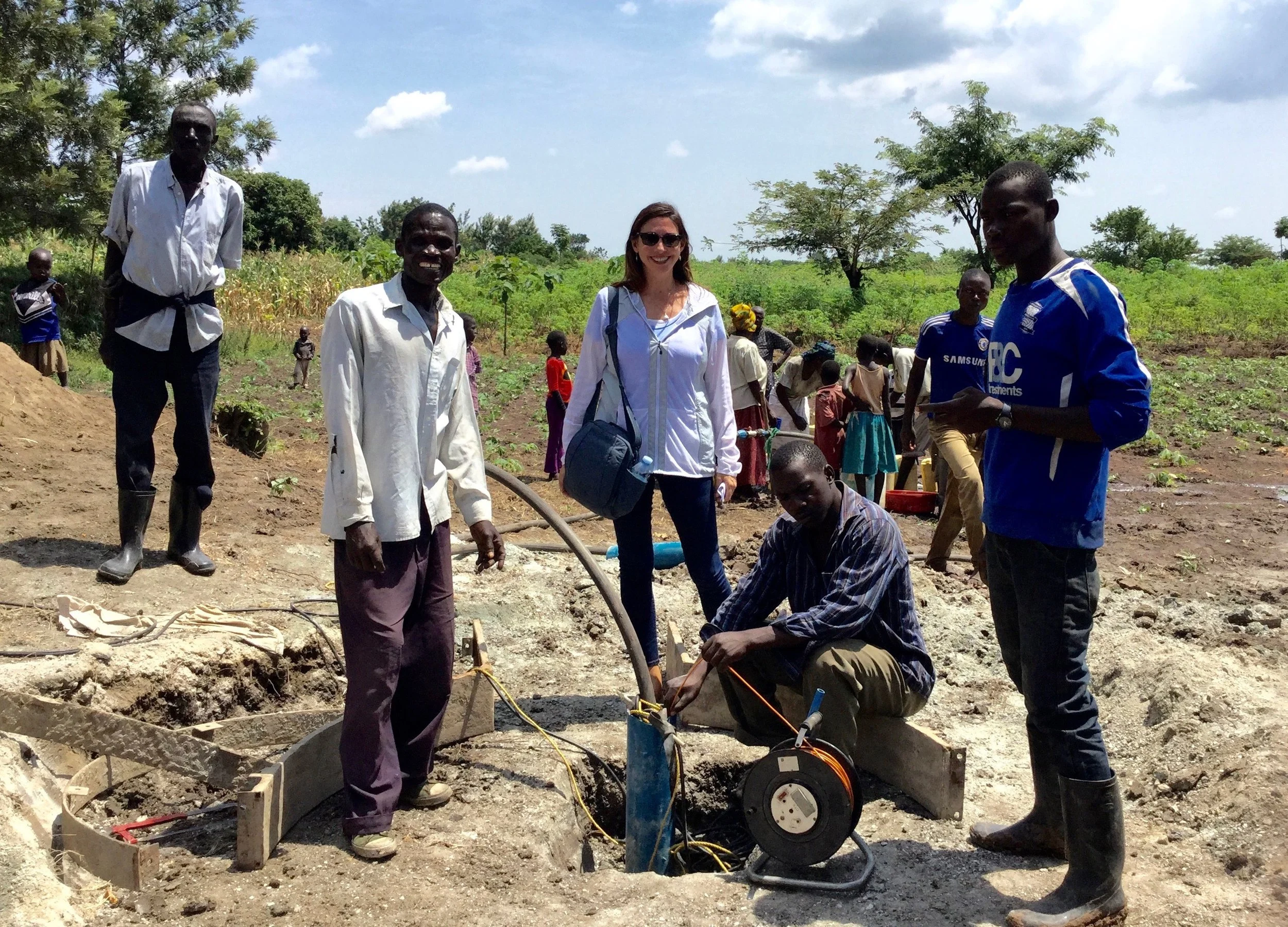 Roxanne Robbins overseeing the installation of a hand pump at well #12 in Busiu, Uganda.