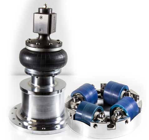 Normal
0
false
false
false
EN-US
X-NONE
X-NONE
Left - Lower suspension square guidance post sitting on air-spring over air chamber and base attachment plate. The post is held to the armature by a screw. Right - Lower guide rollers that surround the guidance post are retained by a ring that is secured to the inner pole piece.