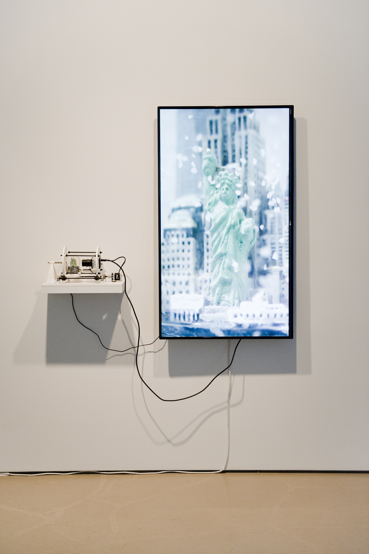   Simulation of a   Simulation (New York),&nbsp; 2015 camera, TV, snowglobe, motor, 3D printed parts, computer 50 x 50 x 9 inches 