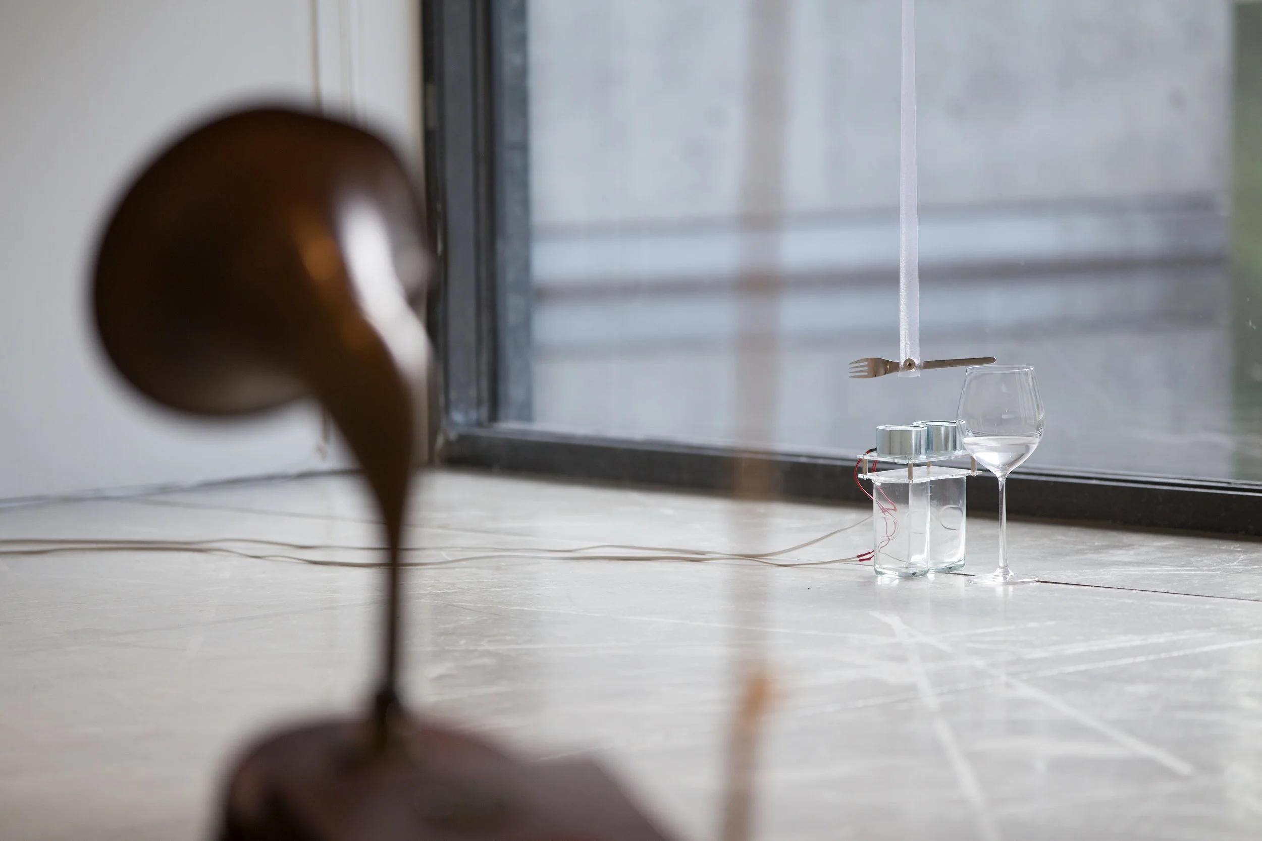 Yuko Mohri, Calls , 2013-14, bells, fork, grass, horn, electric magnet, ribbon, cloth, coil, suit case, etc., dimensions variable. Installation view, ACAC Aomori Contemporary Art Center. Photo: Kuniya Oyamada.