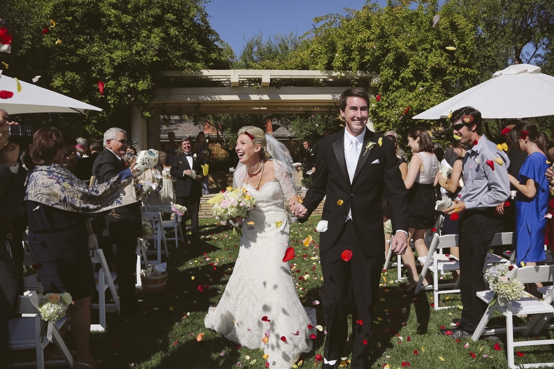 The guests threw rose petals to the happy couple.