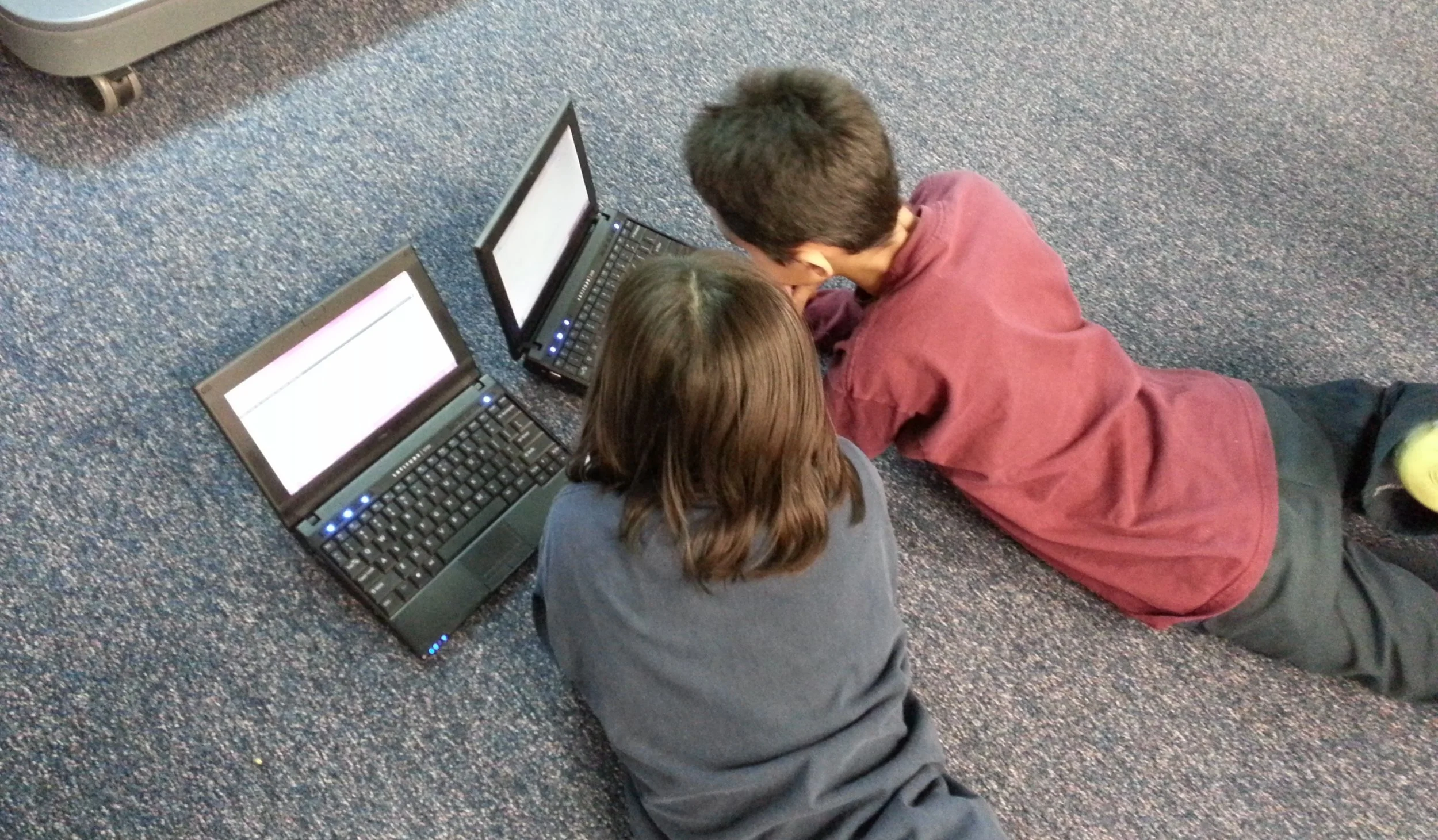 2 kids on laptops.jpg