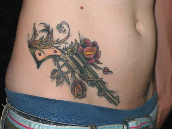 gun-tattoo-apple-tattoo-rochester-new-york.jpg
