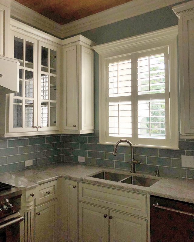 #plantationshutters on windows above kitchen sinks can be tricky when the faucet neck is taller than the window sill. Custom home built by Southern Shores Development- Barry Martin.