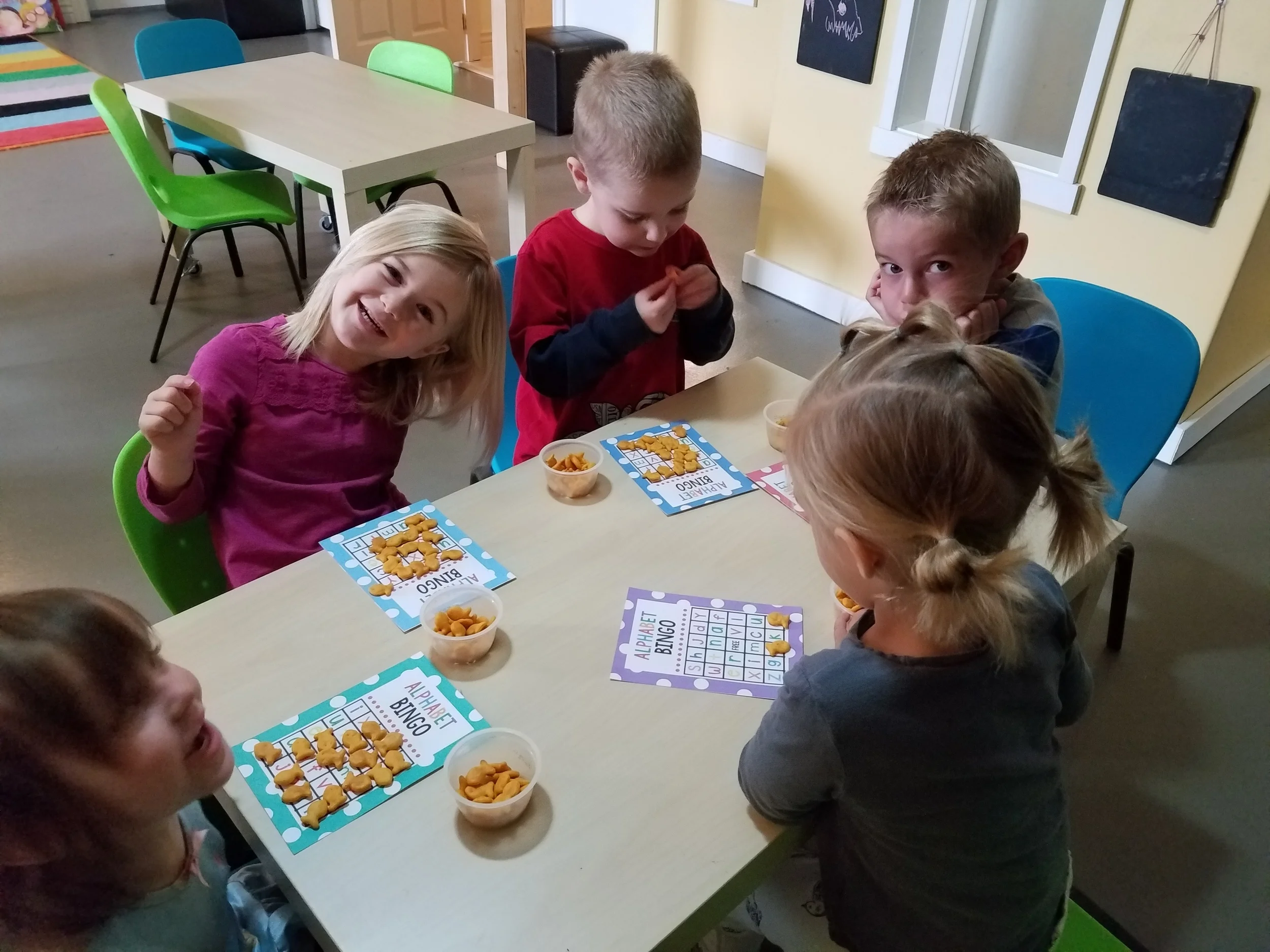 Playing Alphabet Bingo at snack time!