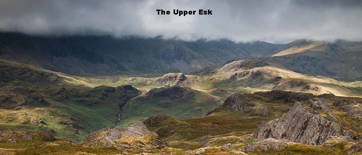 From-Hard-Knott-summit-on-a-bleak-day-as-the-sun-pokes-through-a-heavy-clouda.jpg