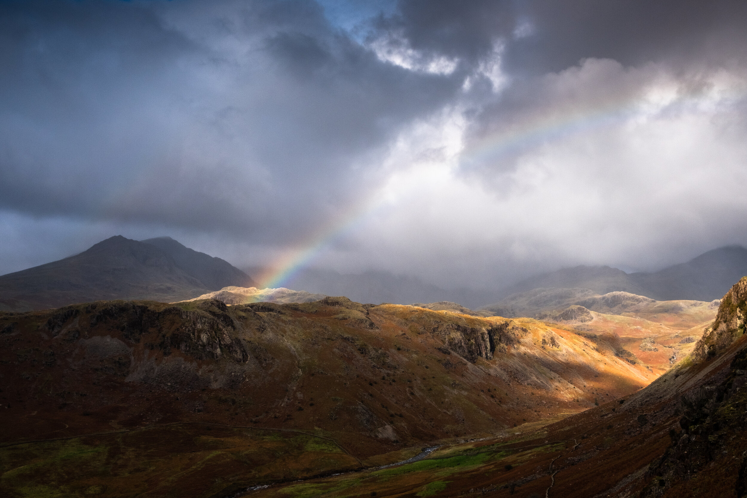 A Storm Approaches The Upper Esk As A Rainbow Starts To Form In Autumn.jpg