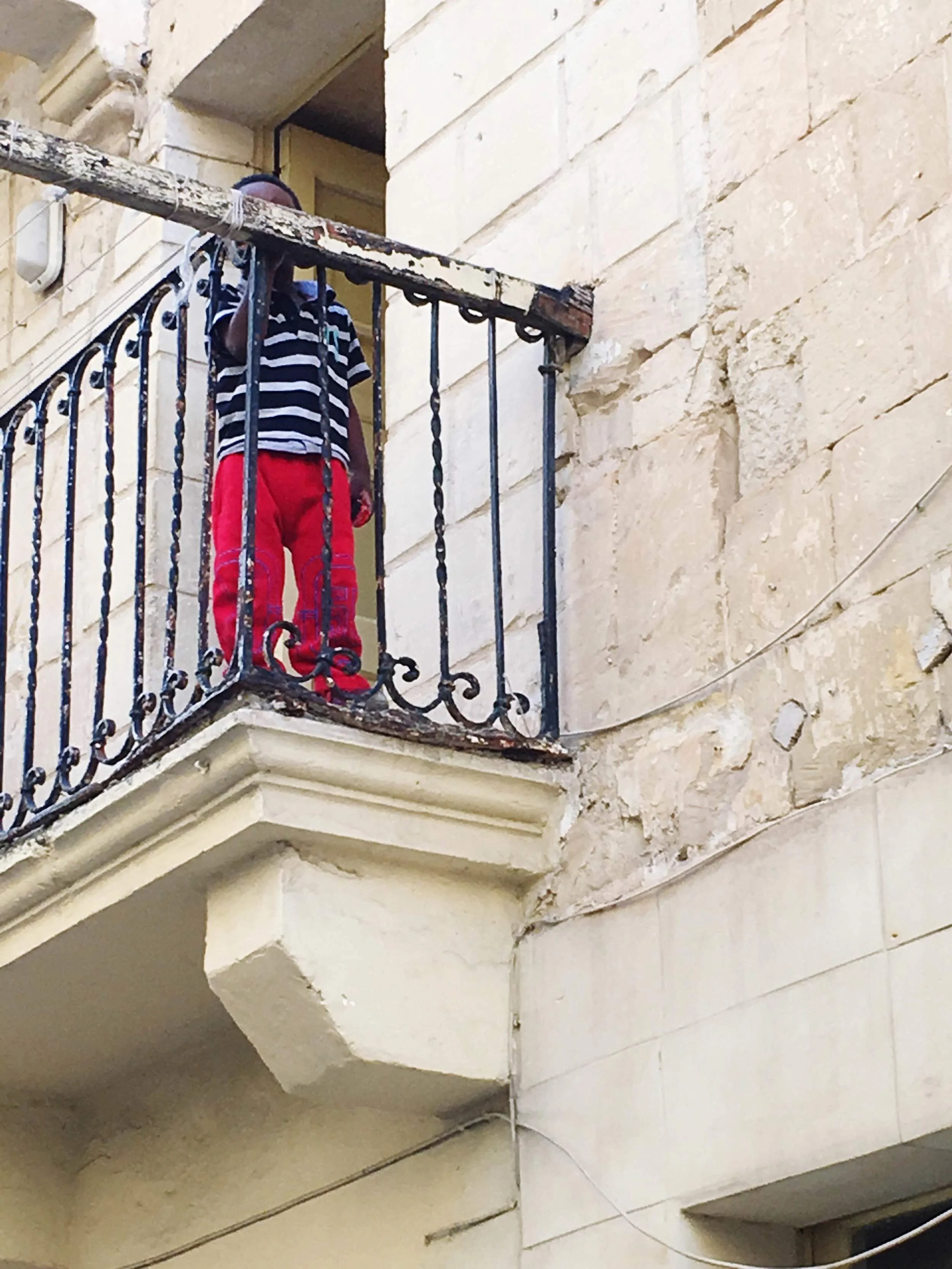 A boy who needs to grow taller to see the full view
