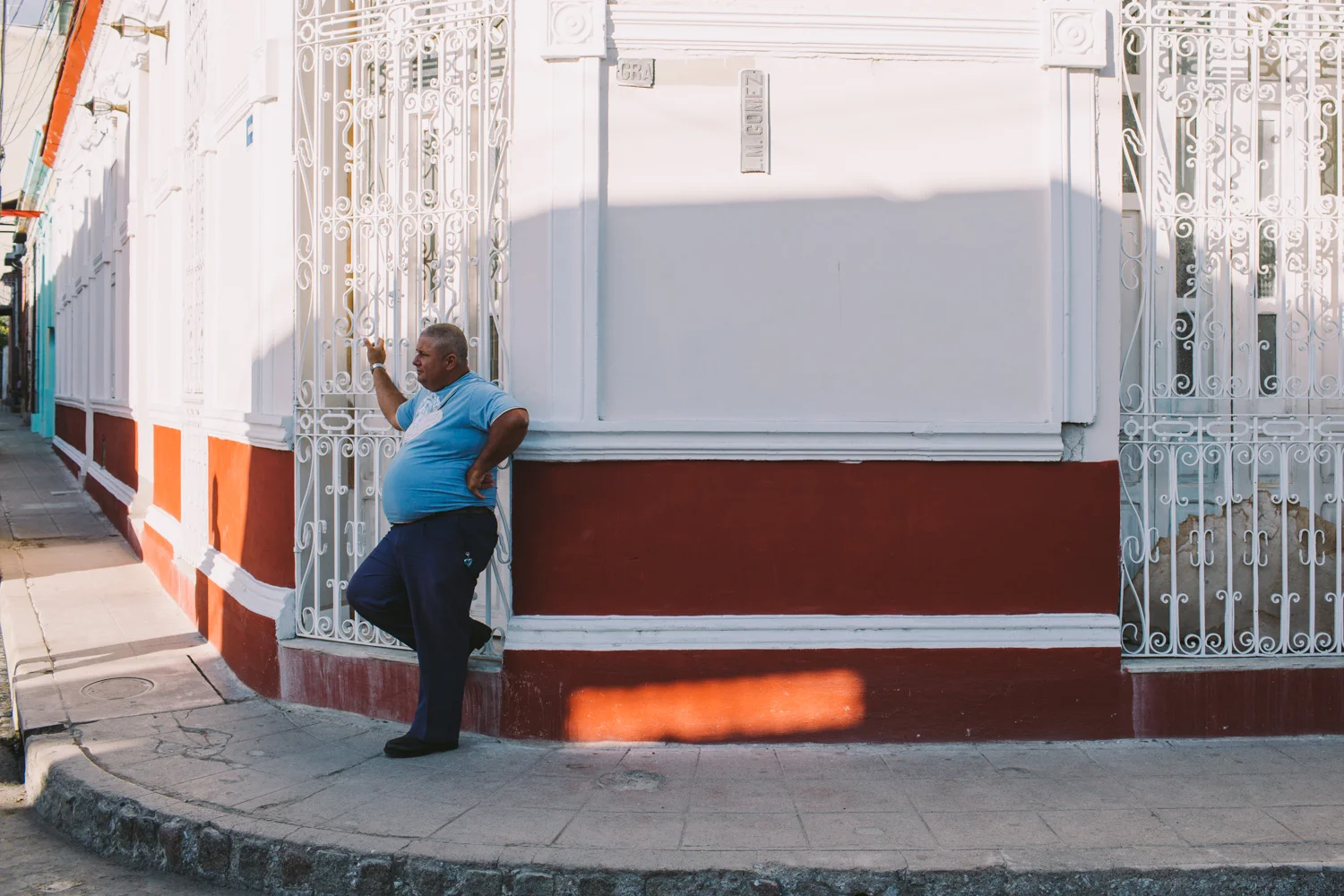 Corners, the best places to see the world go by. Man in corner, Camaguey, Cuba