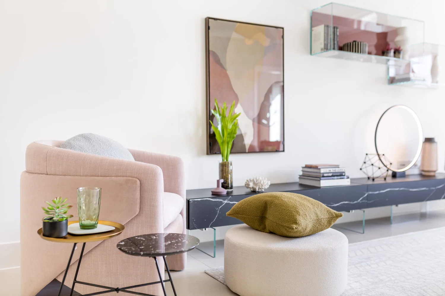 Open plan contemporary living space with blush armchair and marble console in Exeter designed by Michelle Sucksmith