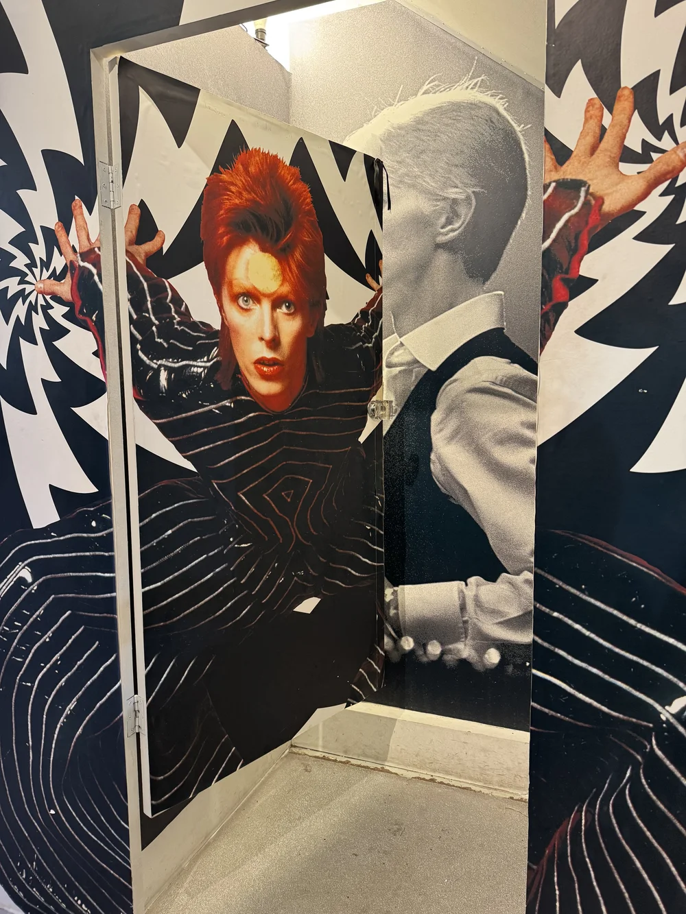 Changing room wallpapered in David Bowie images