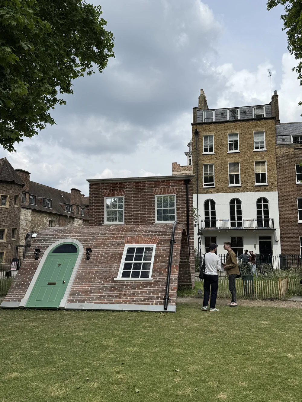 A surreal, slumped brick arch in Charterhouse Square, inviting visitors to walk through its curve. 