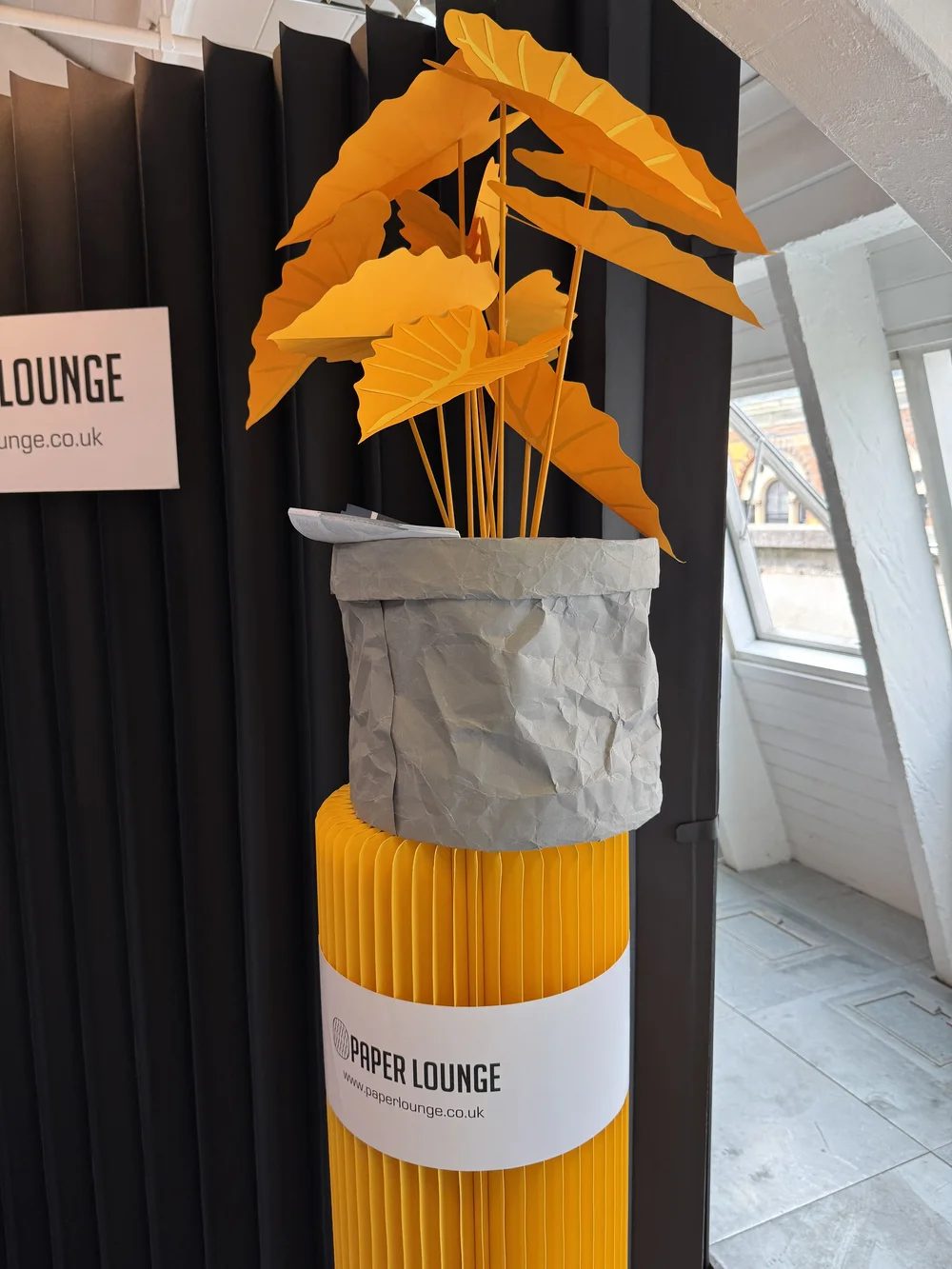 Paper Lounge, and ingenious corrugated paper plant stand.