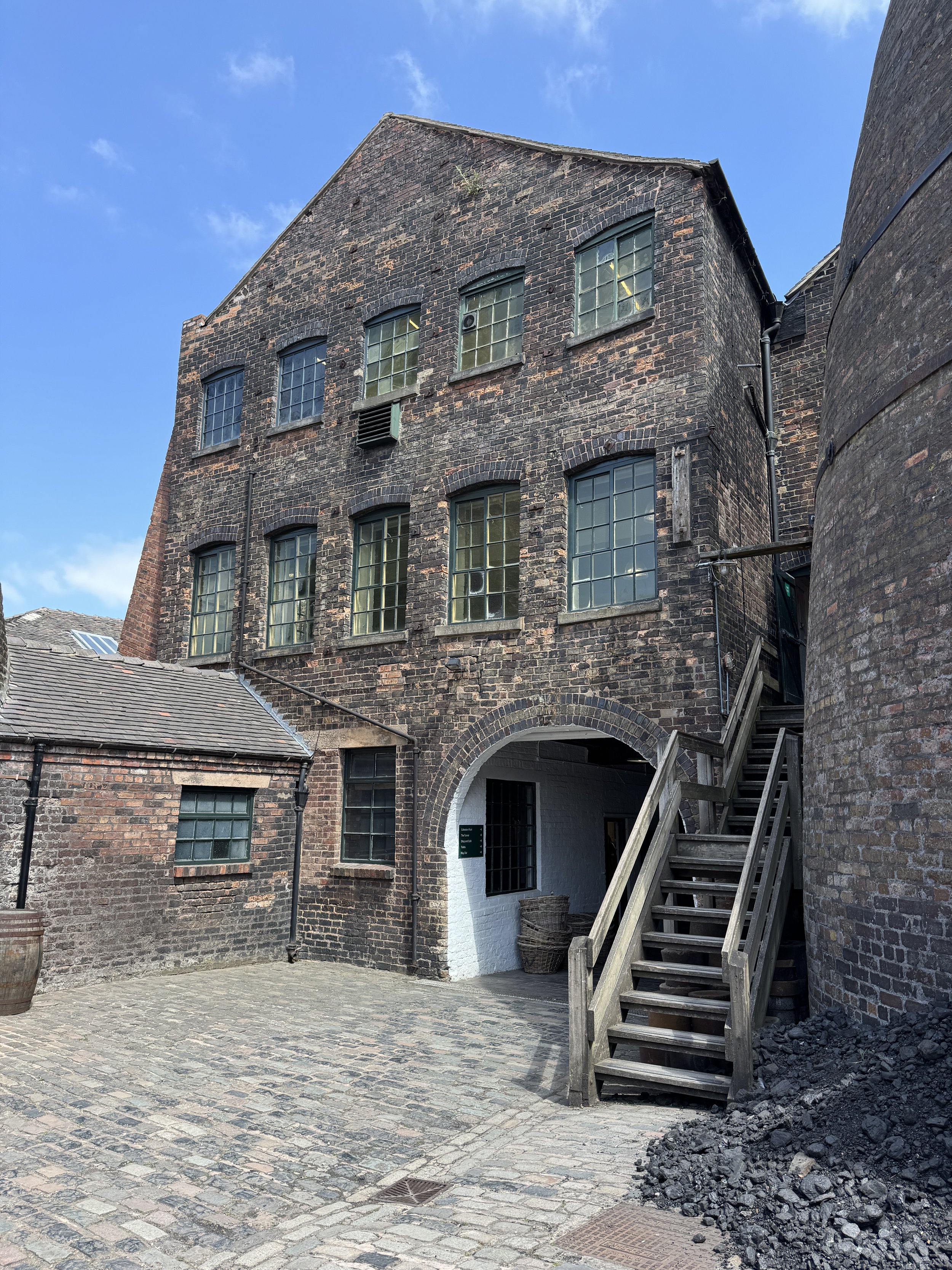 Victorian brick workshop with an outside wooden staircase, Gladstone Pottery Museum