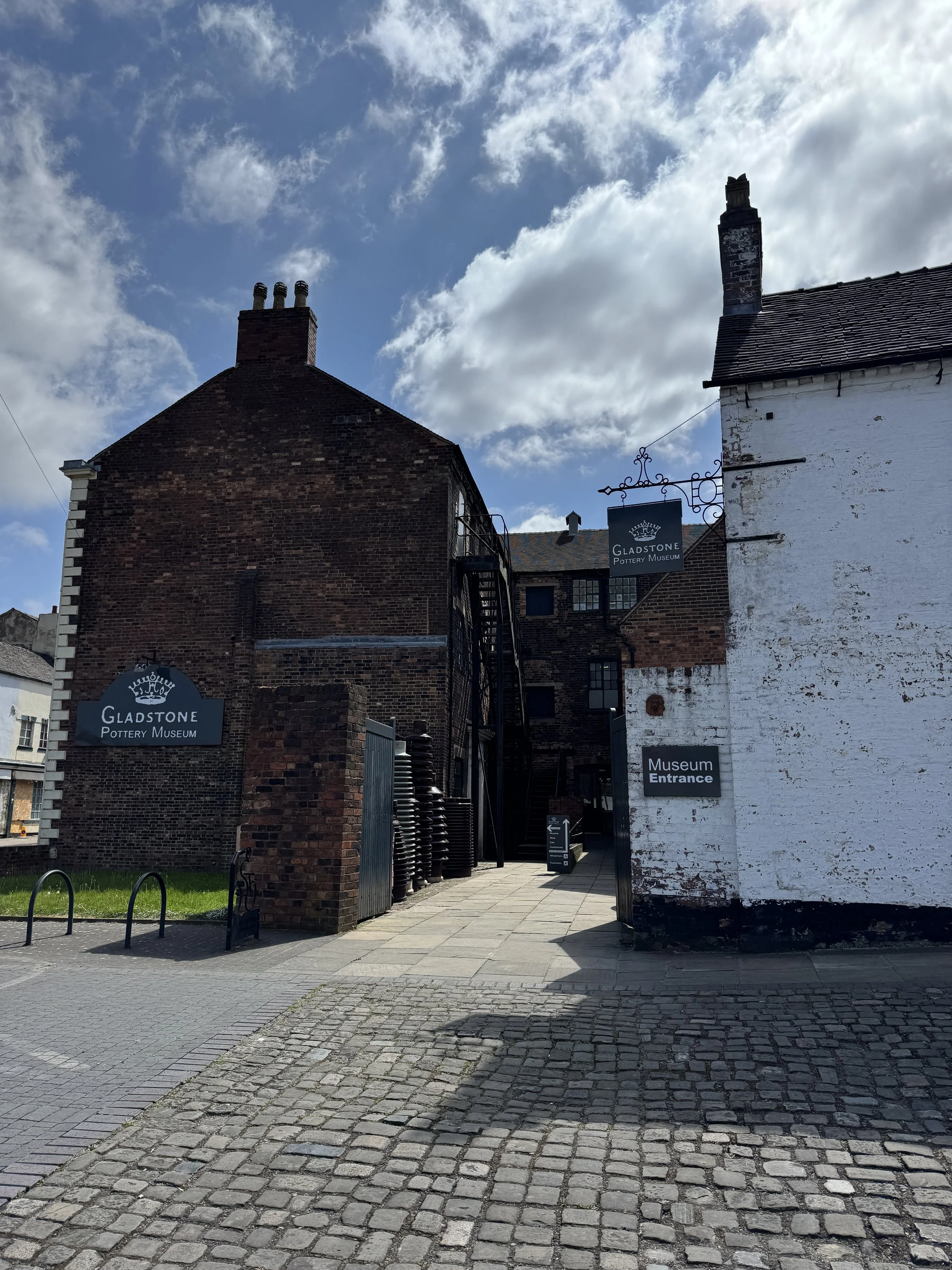 Cobbled entrance yard and brick works buildings, Gladstone Pottery Museum