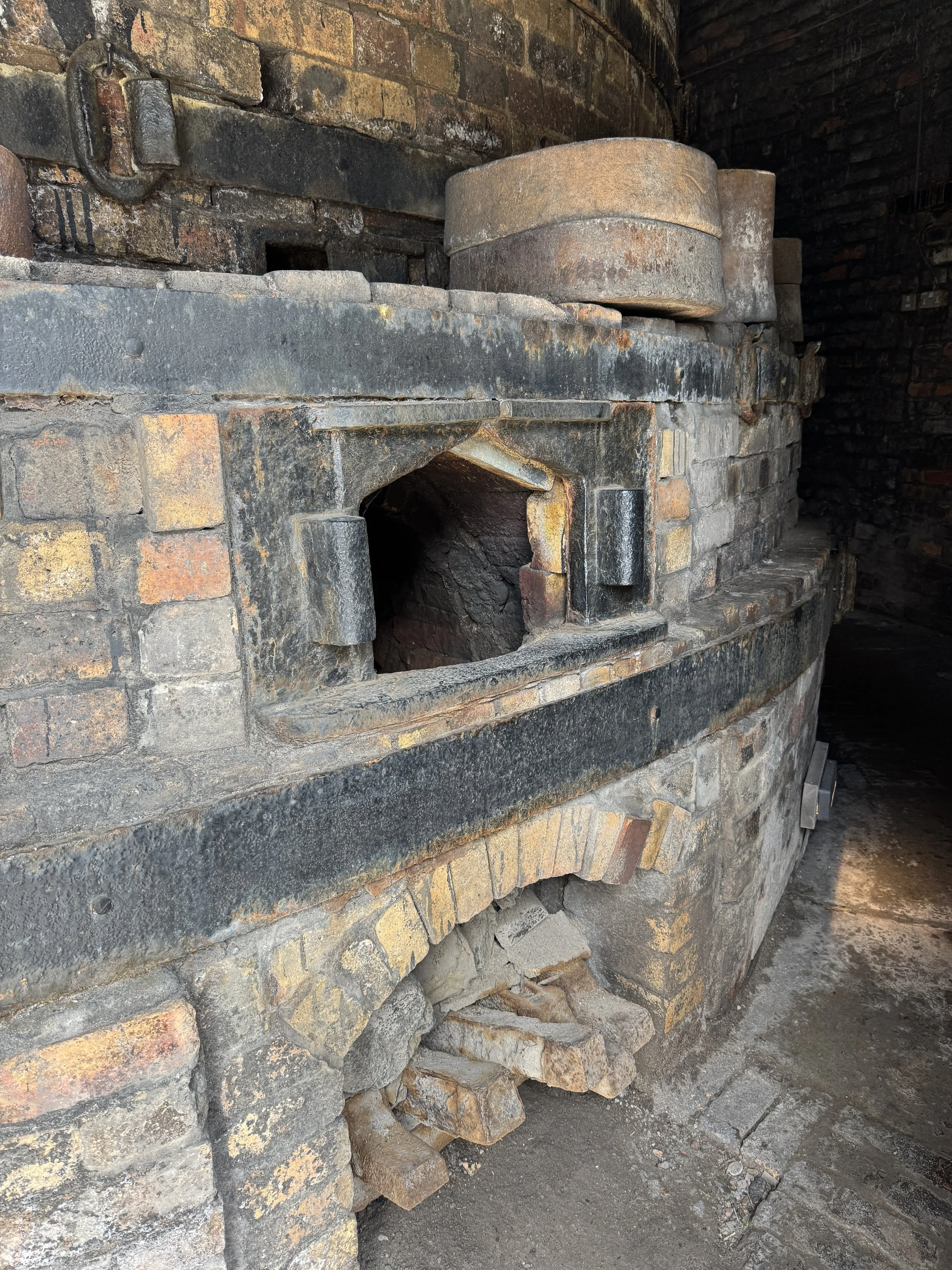 Firemouths around the base of a bottle kiln, Gladstone Pottery Museum
