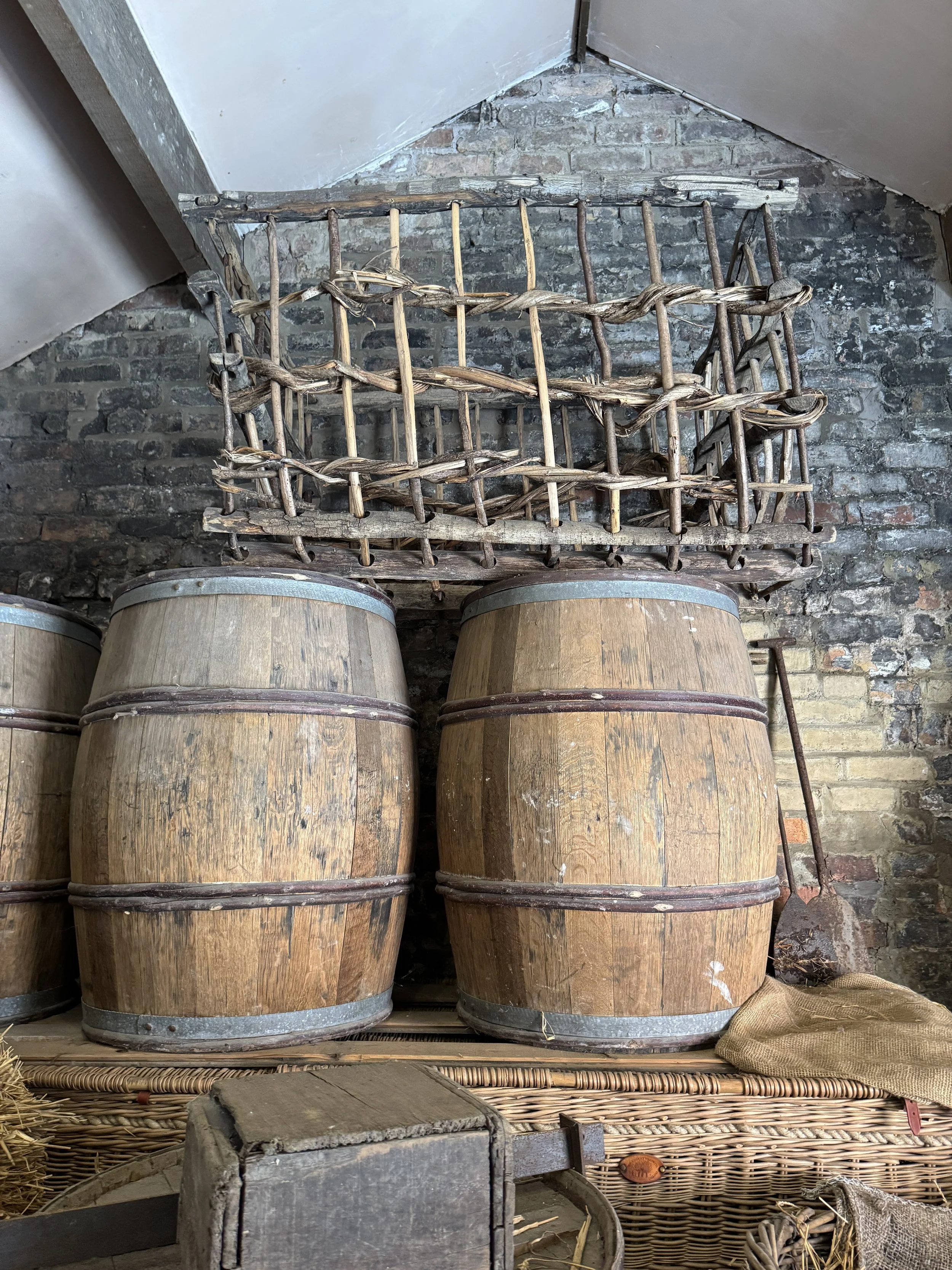 Wooden barrels and a crate in a brick workshop, Gladstone Pottery Museum