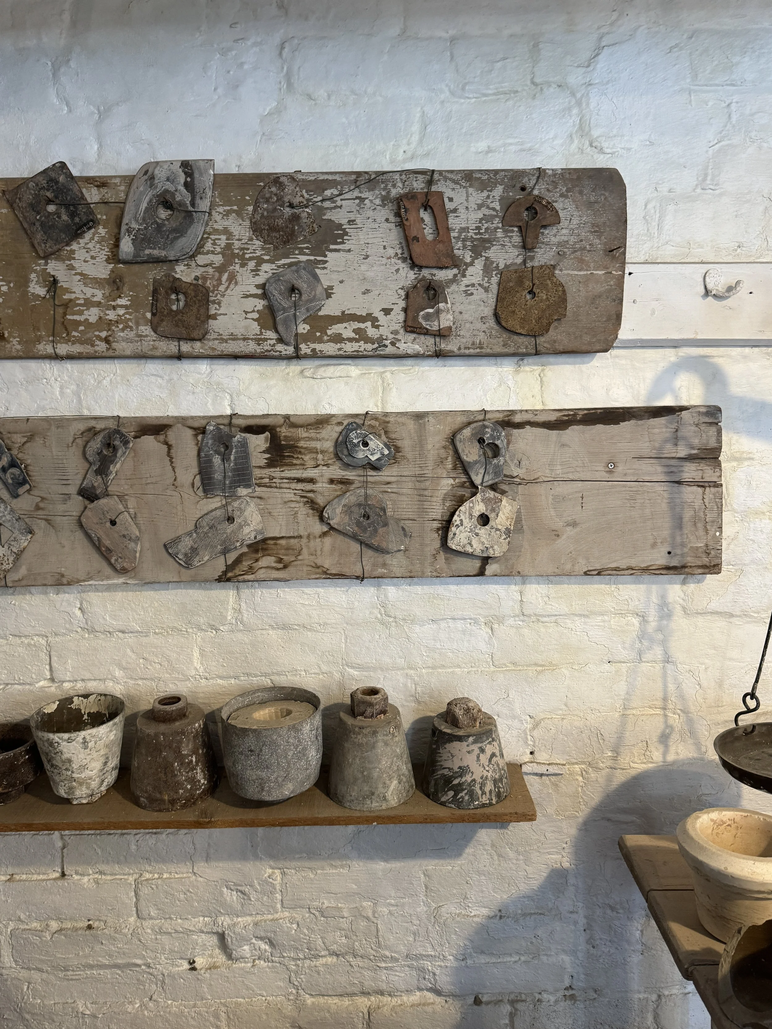 Old plaster moulds on wooden boards in a workshop, Gladstone Pottery Museum