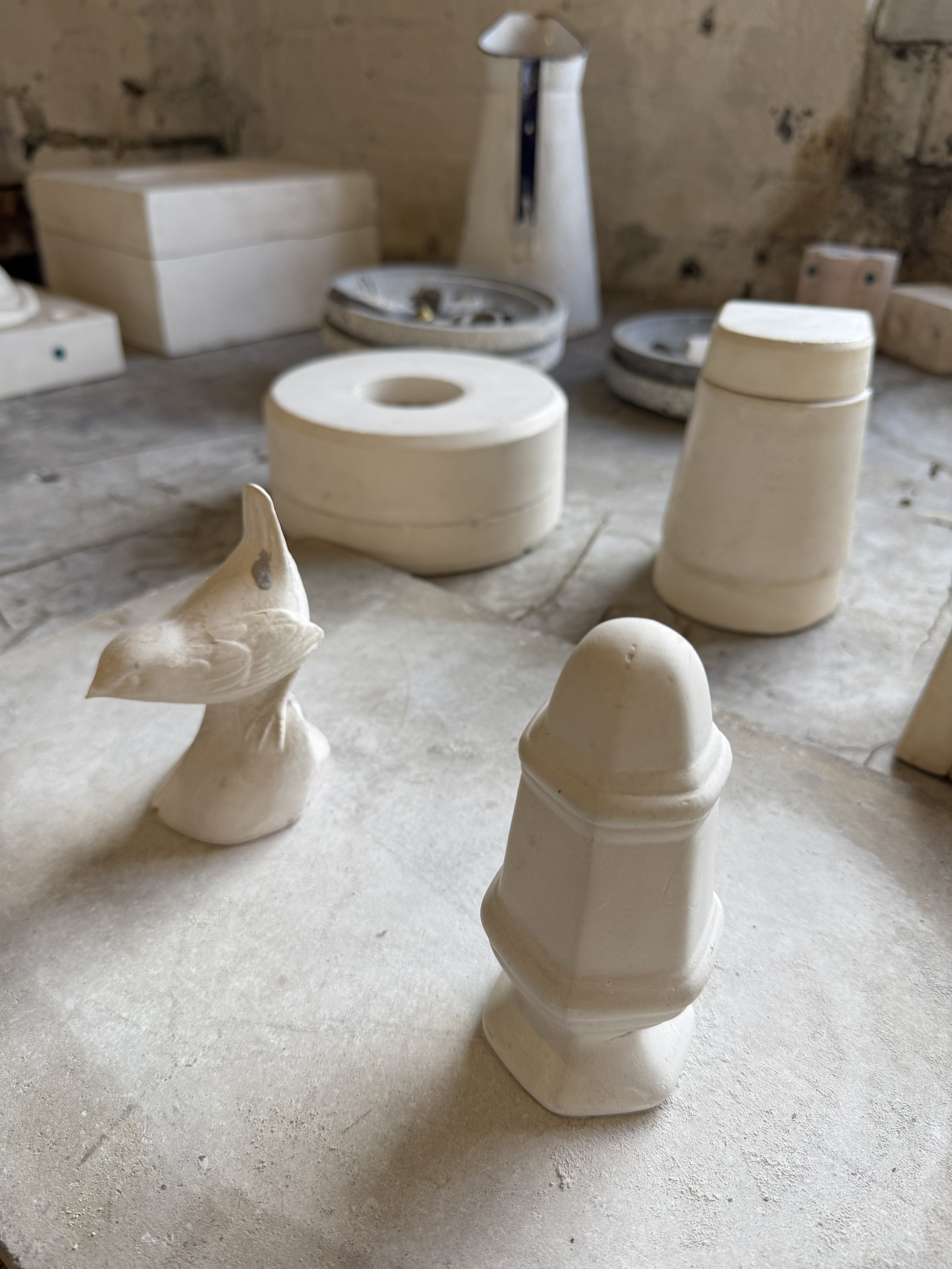 Plaster moulds and cast pieces on a workbench, Gladstone Pottery Museum
