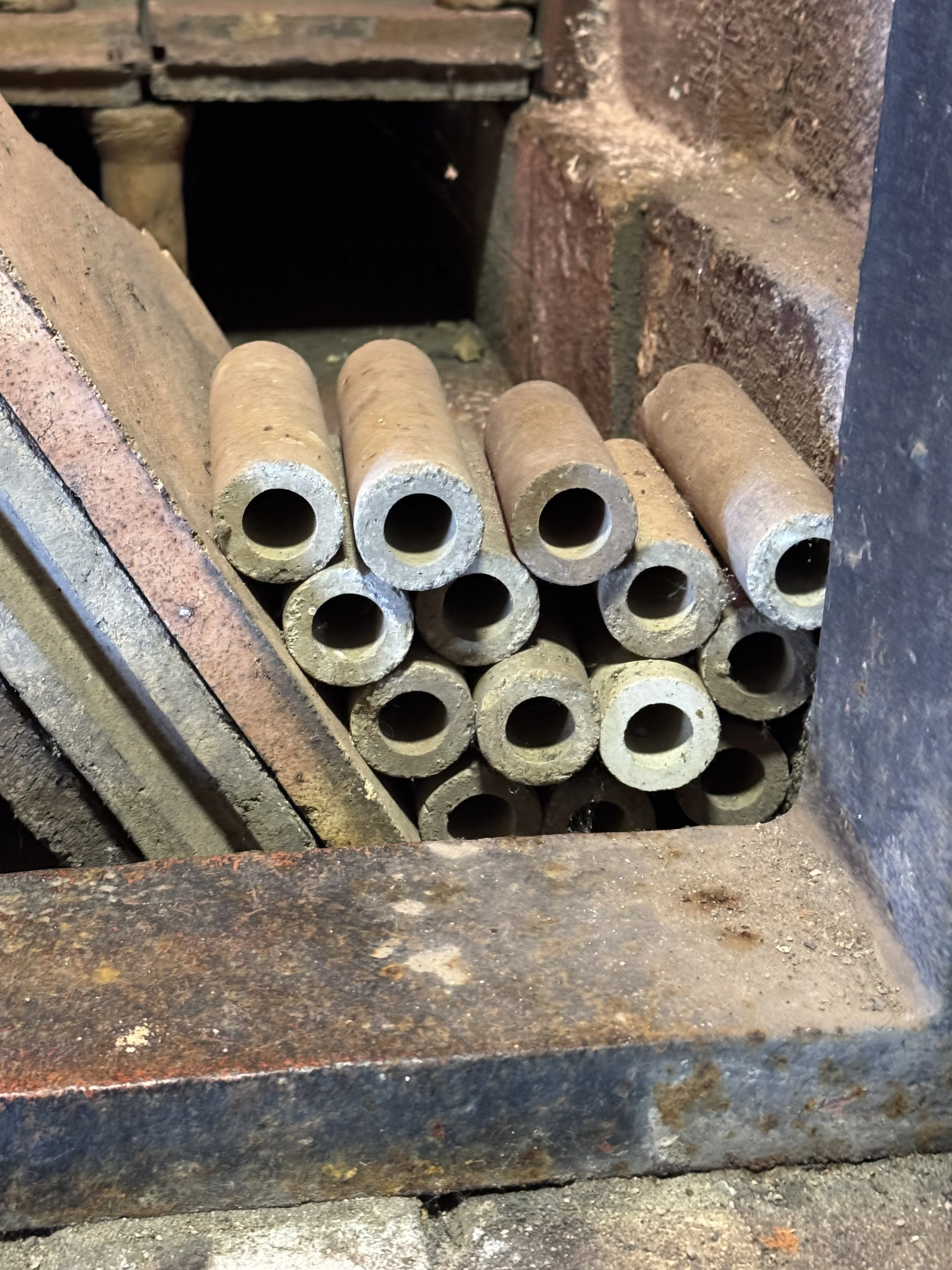 Stacked clay pipes in a brick store, Gladstone Pottery Museum