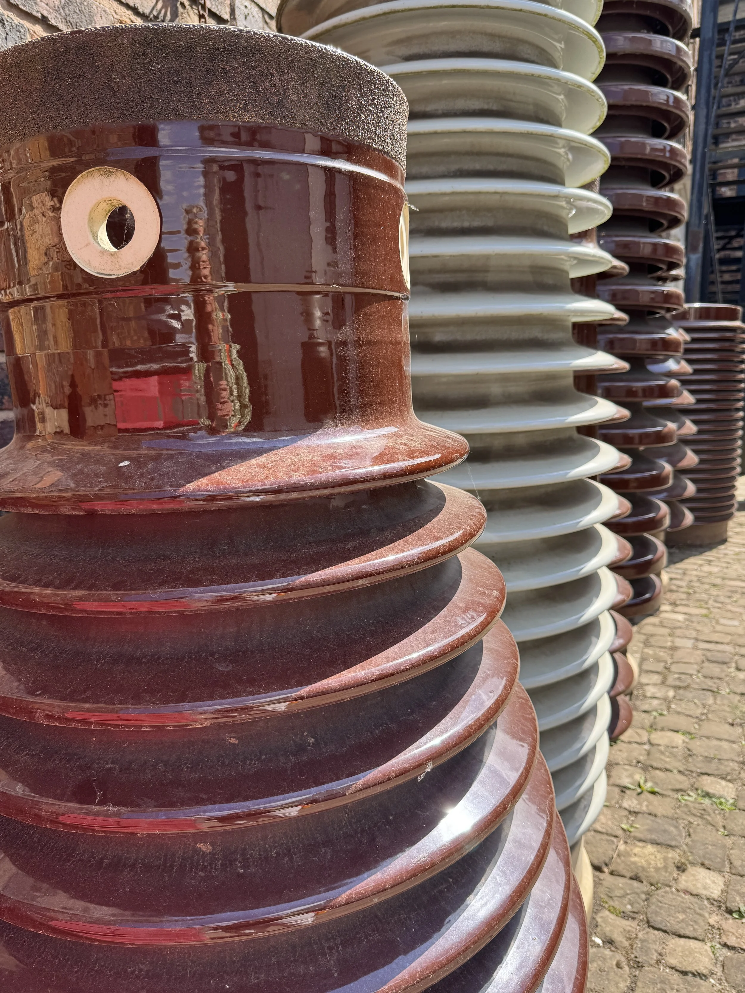 Close up of glazed ceramic insulators, Gladstone Pottery Museum