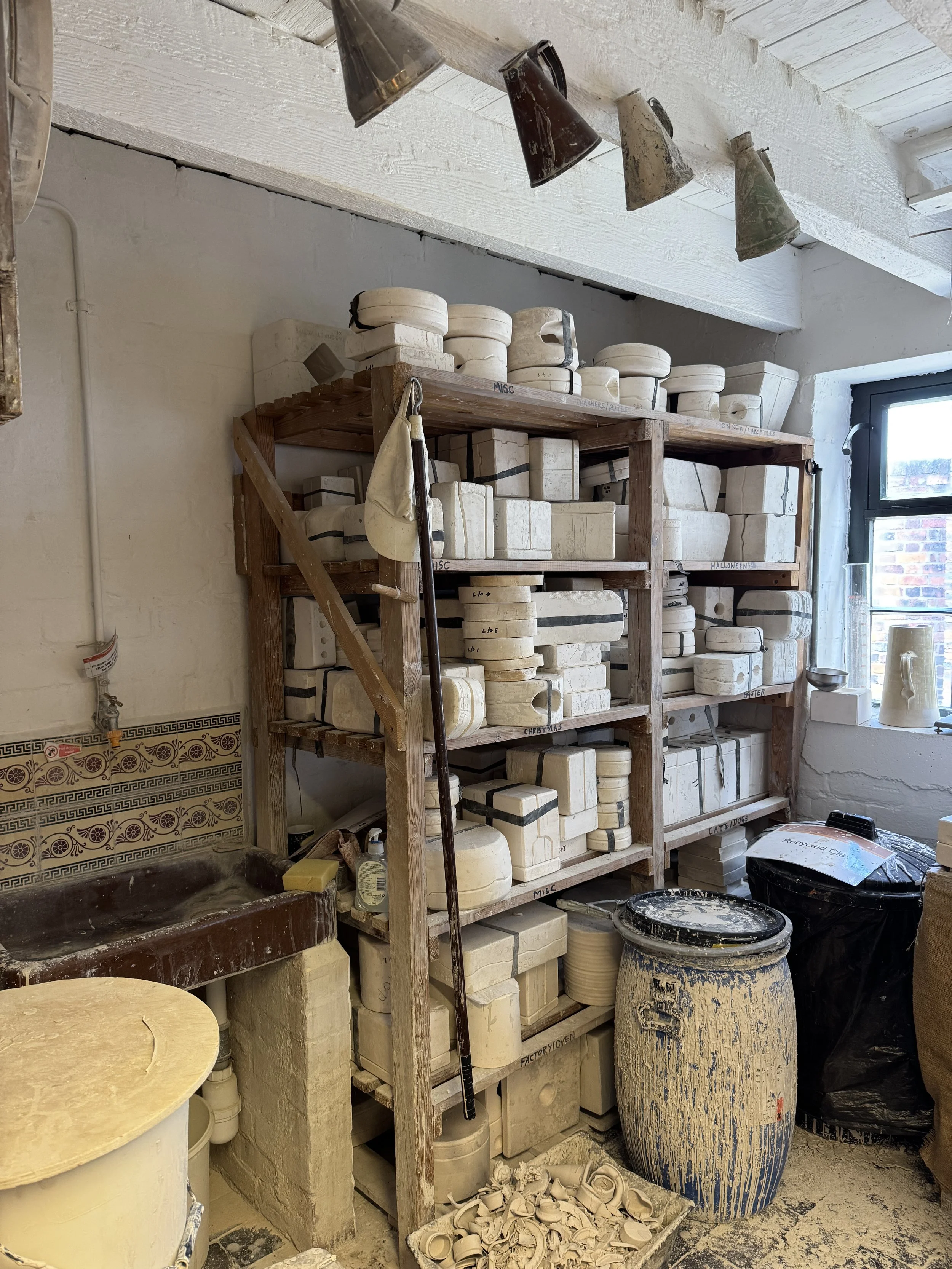Potter's workshop shelves stacked with moulds, Gladstone Pottery Museum